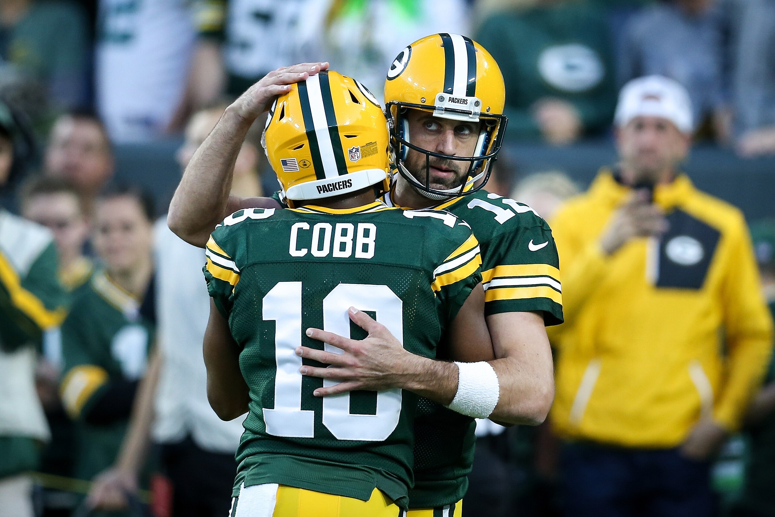 GREEN BAY, WI - SEPTEMBER 09:  Randall Cobb #18 and Aaron Rodgers #12 of the Green Bay Packers meet before the game against the Chicago Bears at Lambeau Field on September 9, 2018 in Green Bay, Wisconsin.  (Photo by Dylan Buell/Getty Images)
