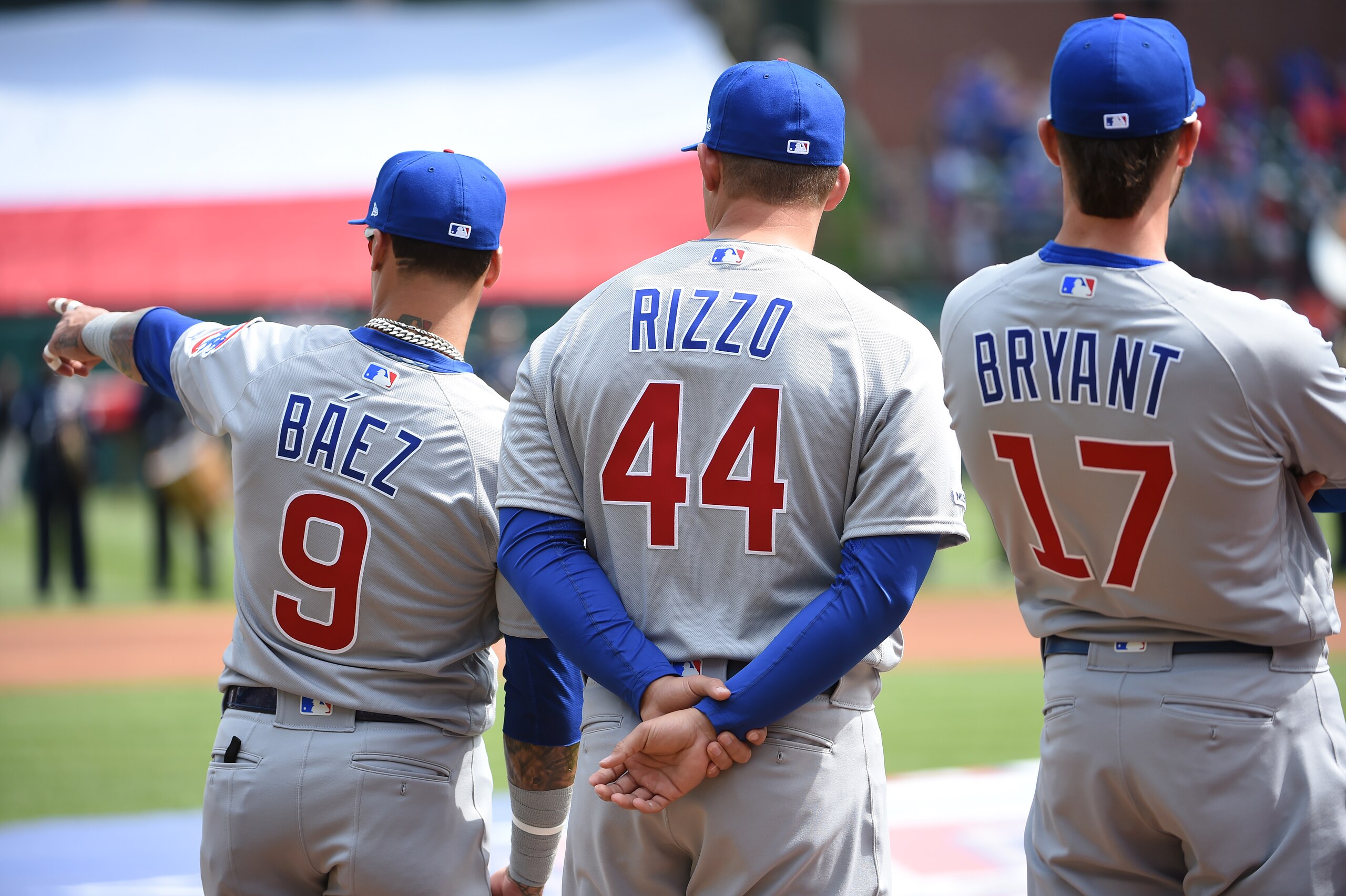 ARLINGTON, TX - MARCH 28: Javier Baez #9, Anthony Rizzo #44 and Kris Bryant #17 of the Chicago Cubs are seen during player introductions before the game between the Chicago Cubs and the Texas Rangers at Globe Life Park in Arlington on Thursday, March 28, 2019 in Arlington, Texas. (Photo by Cooper Neill/MLB via Getty Images) ARLINGTON, TX - MARCH 28: Javier Baez #9, Anthony Rizzo #44 and Kris Bryant #17 of the Chicago Cubs are seen during player introductions before the game between the Chicago Cubs and the Texas Rangers at Globe Life Park in Arlington on Thursday, March 28, 2019 in Arlington, Texas. (Photo by Cooper Neill/MLB via Getty Images)