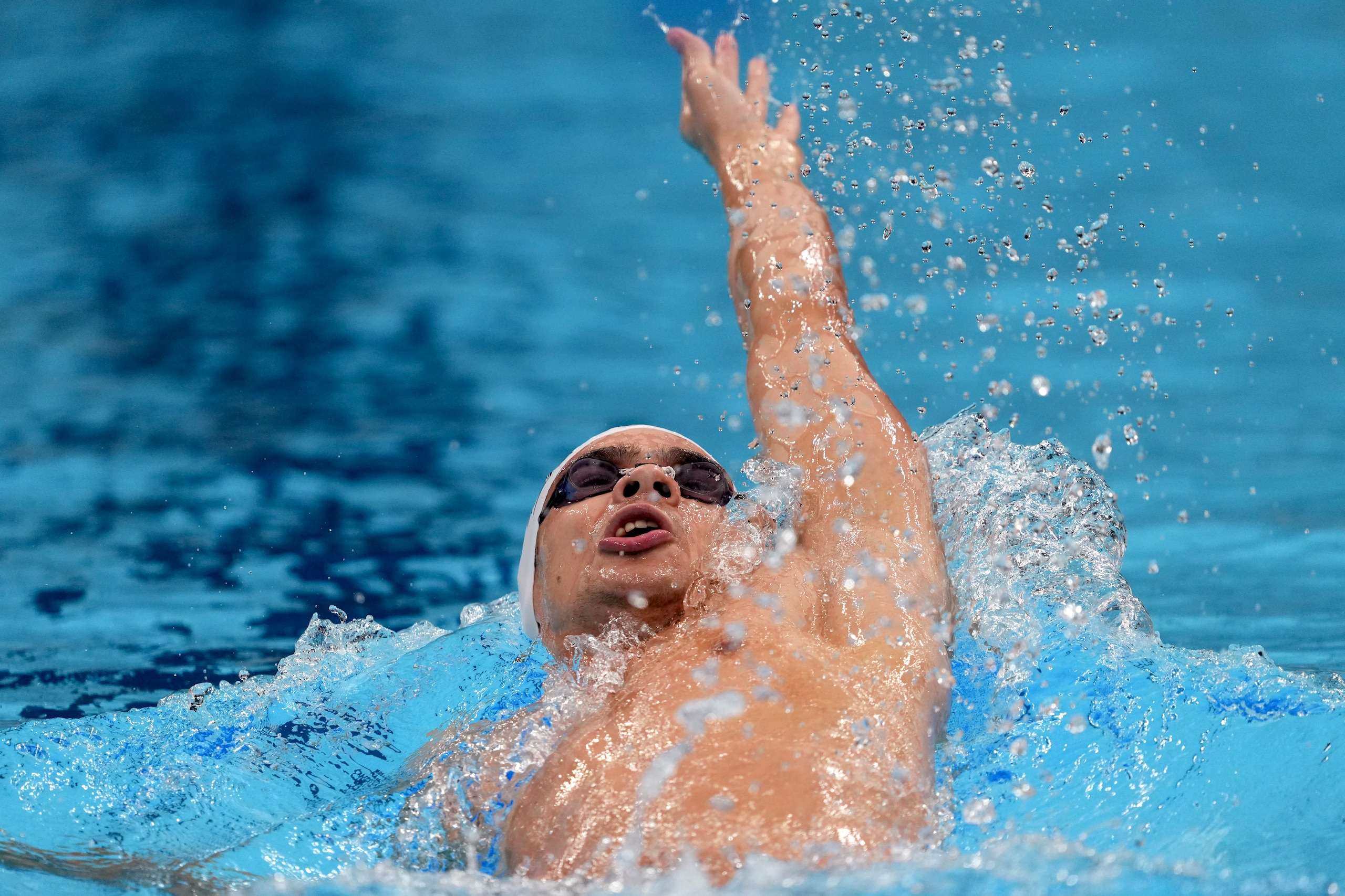 Evgeny Rylov of the Russian Olympic Committee swims in a men's 200-meter backstroke semifinal at the 2020 Summer Olympics, Thursday, July 29, 2021, in Tokyo, Japan. (AP Photo/Matthias Schrader)