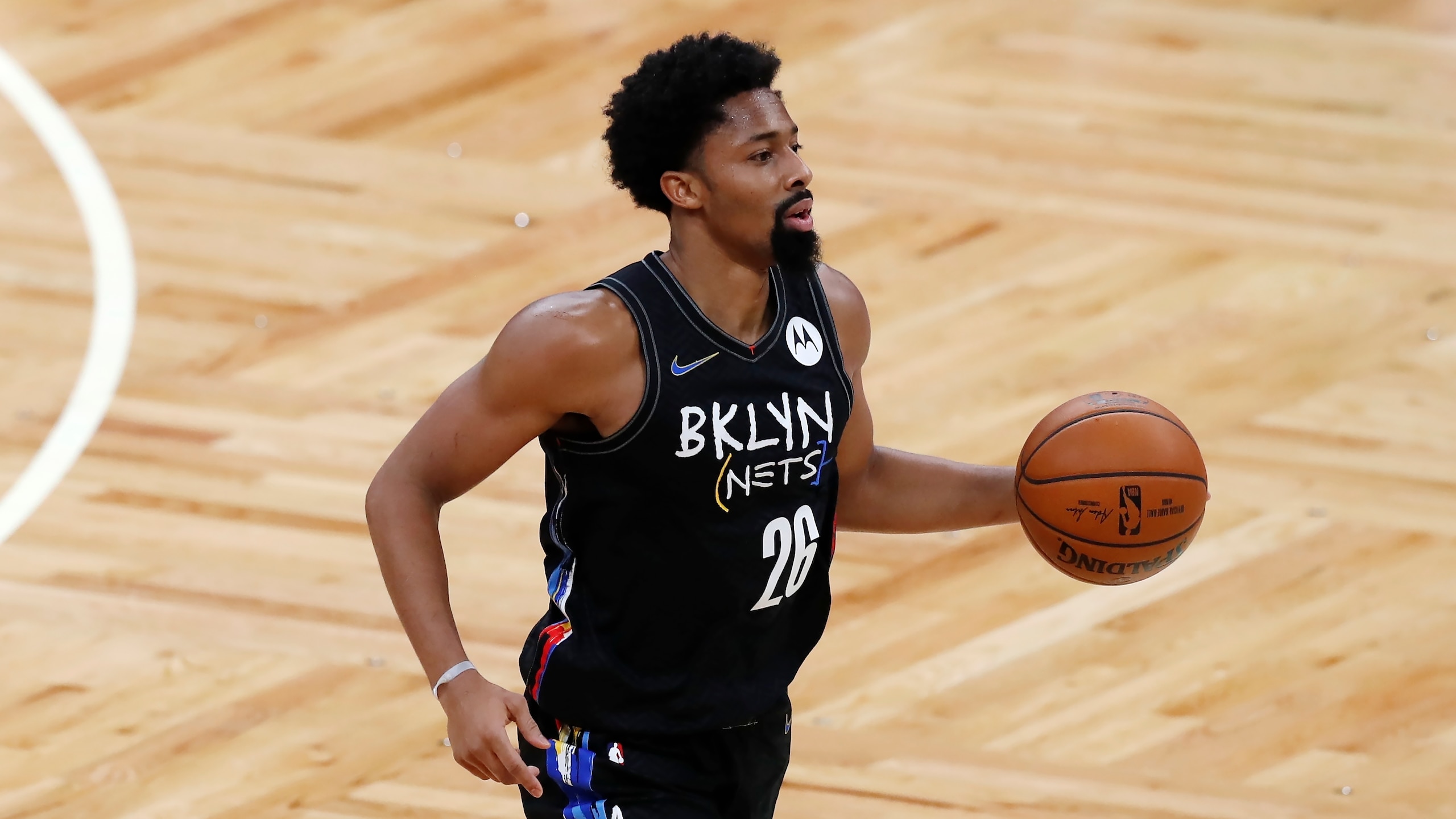 Brooklyn Nets' Spencer Dinwiddie plays against the Boston Celtics during the first half of an NBA basketball game, Friday, Dec. 25, 2020, in Boston. (AP Photo/Michael Dwyer)
