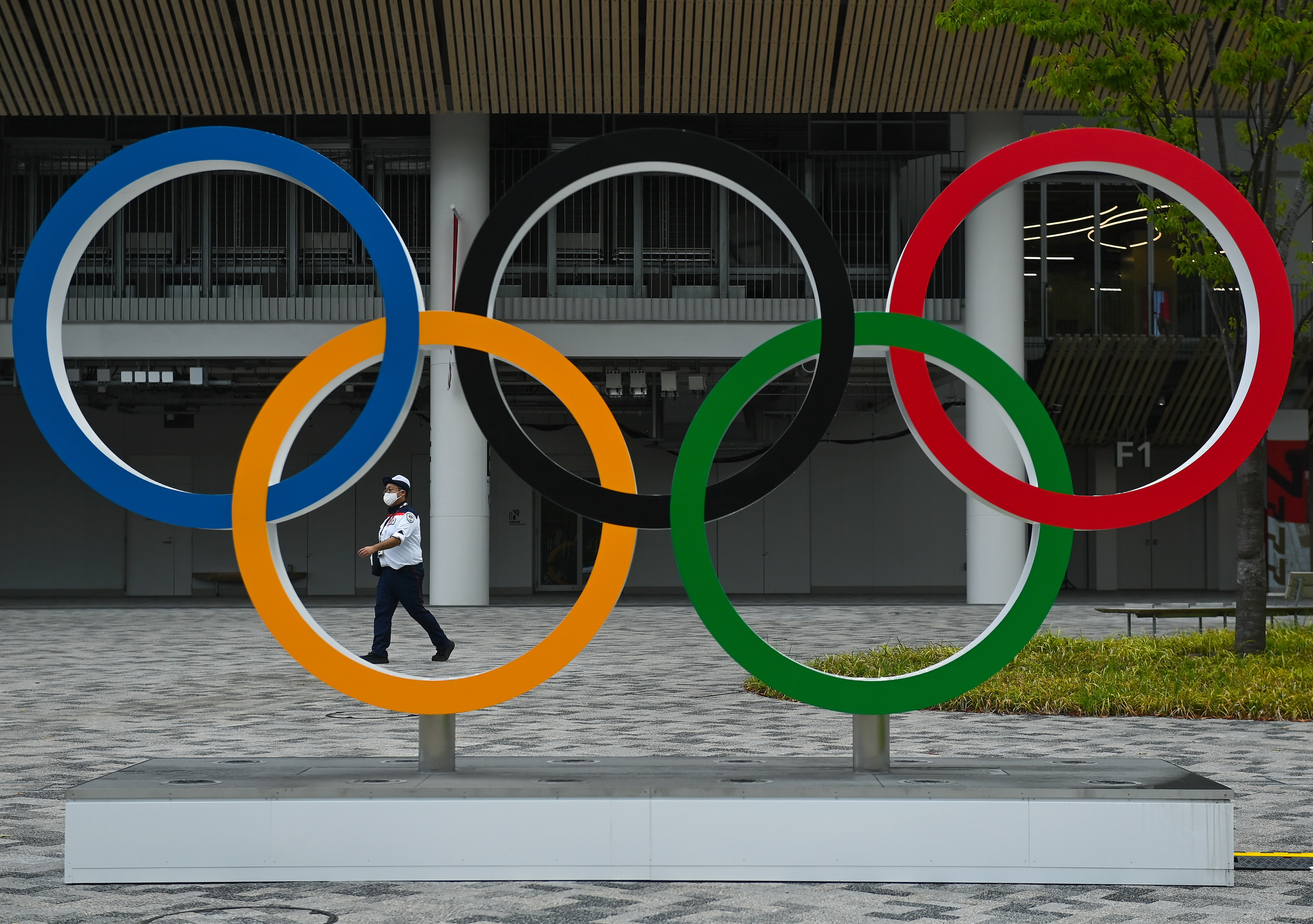 Tokyo , Japan - 30 July 2021; A security guard on duty outside the Olympic Stadium prior to the first athletics session of the 2020 Tokyo Summer Olympic Games in Tokyo, Japan. (Photo By Brendan Moran/Sportsfile via Getty Images)