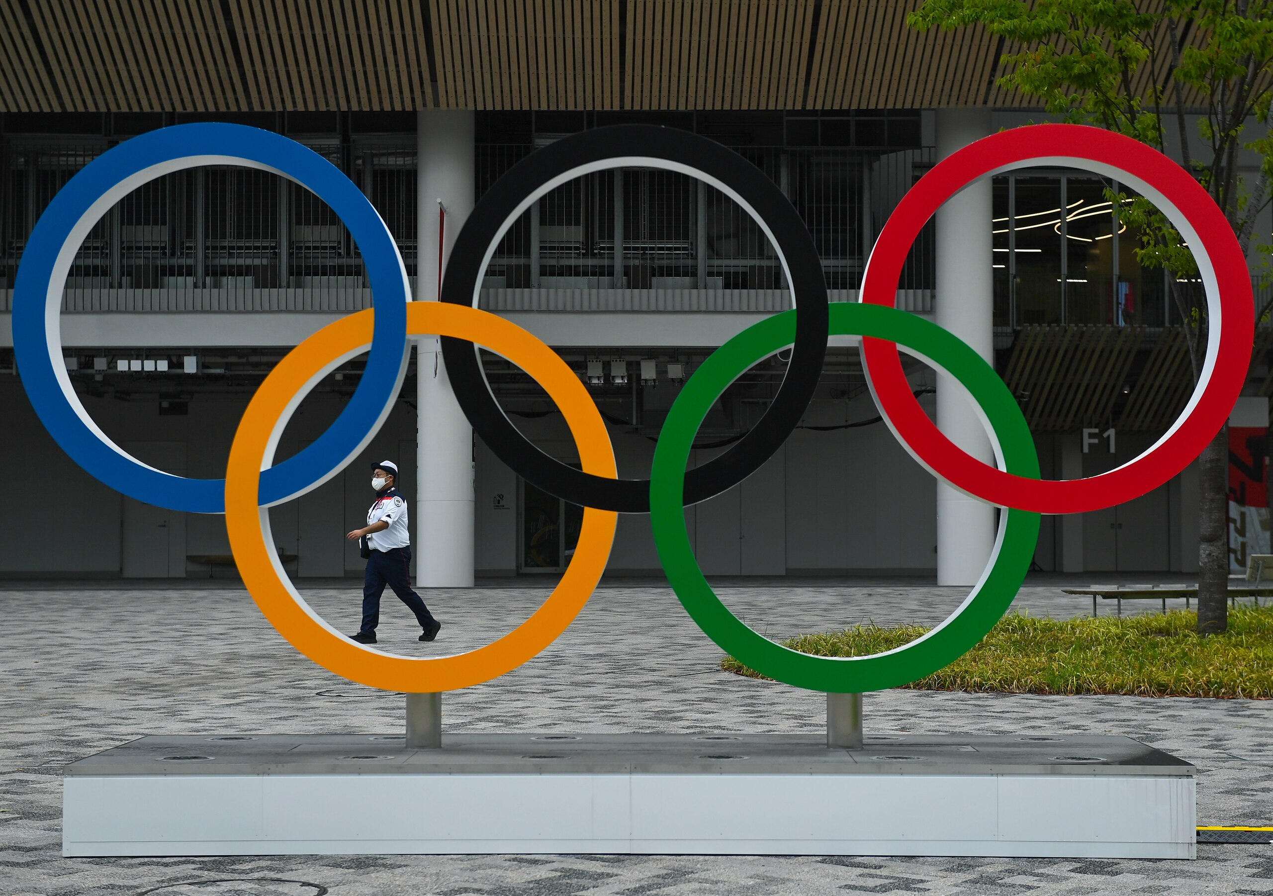 Tokyo , Japan - 30 July 2021; A security guard on duty outside the Olympic Stadium prior to the first athletics session of the 2020 Tokyo Summer Olympic Games in Tokyo, Japan. (Photo By Brendan Moran/Sportsfile via Getty Images)