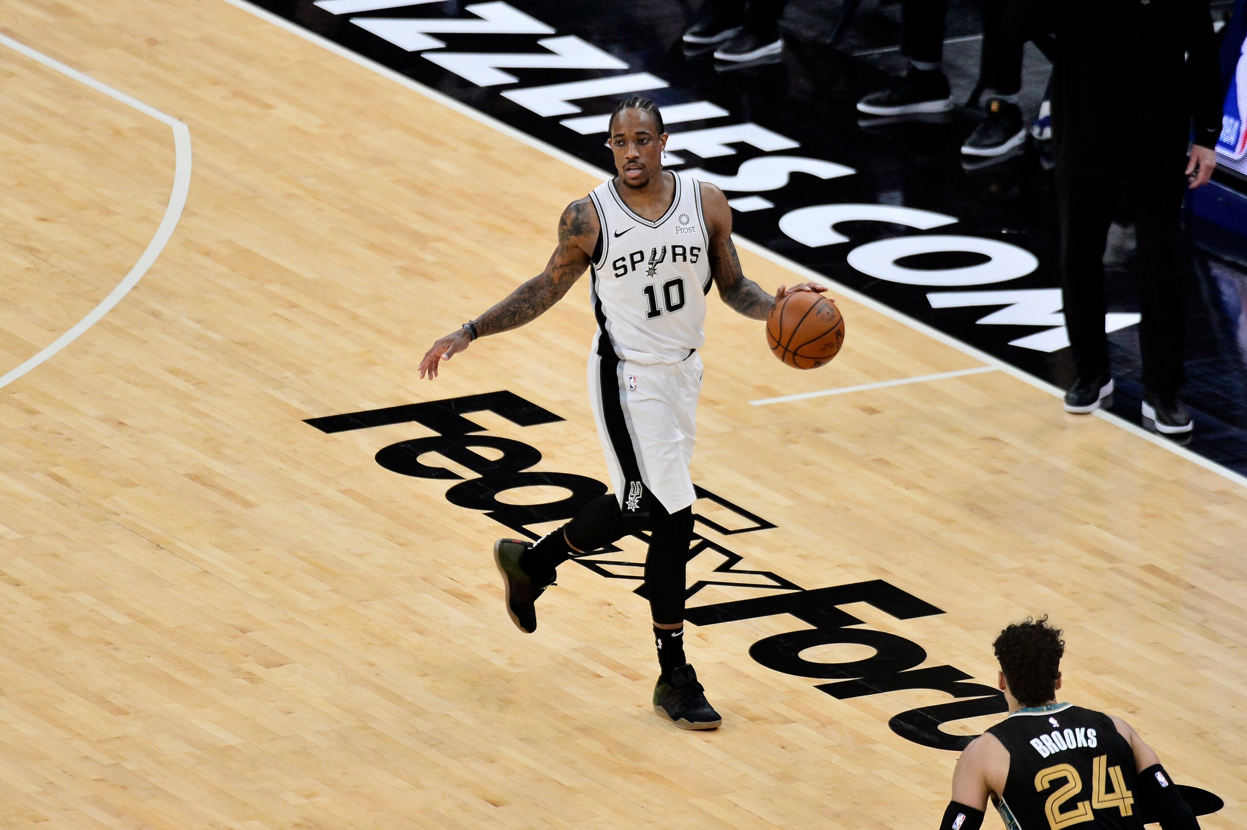 San Antonio Spurs forward DeMar DeRozan (10) handles the ball in the first half of an NBA basketball Western Conference play-in game against the Memphis Grizzlies Wednesday, May 19, 2021, in Memphis, Tenn. (AP Photo/Brandon Dill)