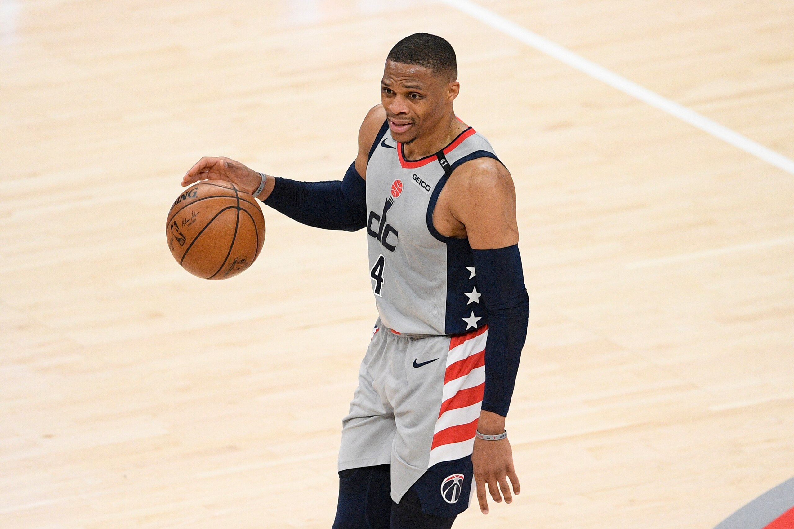 Washington Wizards guard Russell Westbrook (4) dribbles the ball during the first half of Game 3 in a first-round NBA basketball playoff series against the Philadelphia 76ers, Saturday, May 29, 2021, in Washington. (AP Photo/Nick Wass)