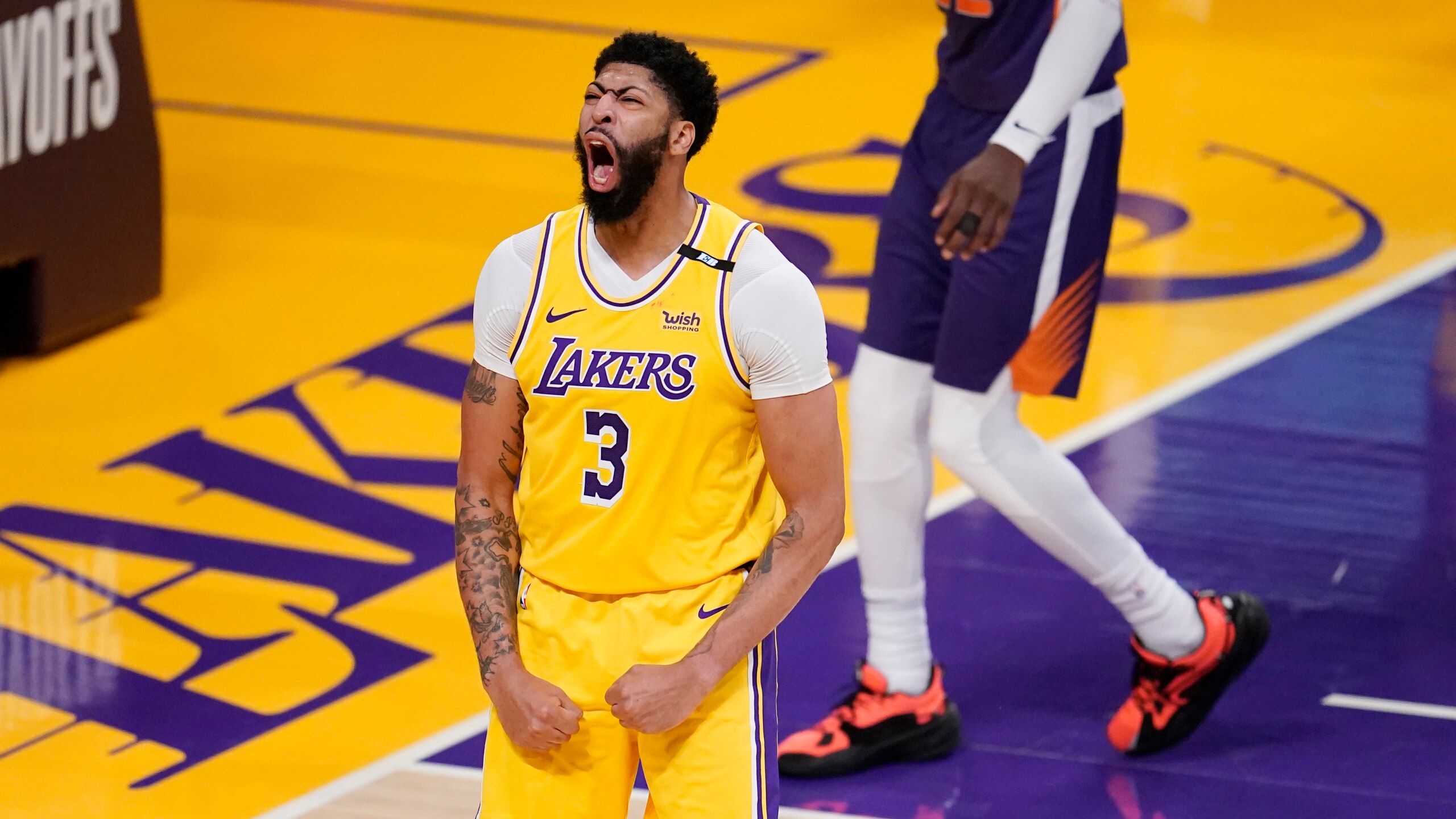 Los Angeles Lakers forward Anthony Davis (3) celebrates after scoring during the second half in Game 3 of an NBA basketball first-round playoff series against the Phoenix Suns Thursday, May 27, 2021, in Los Angeles. (AP Photo/Marcio Jose Sanchez)