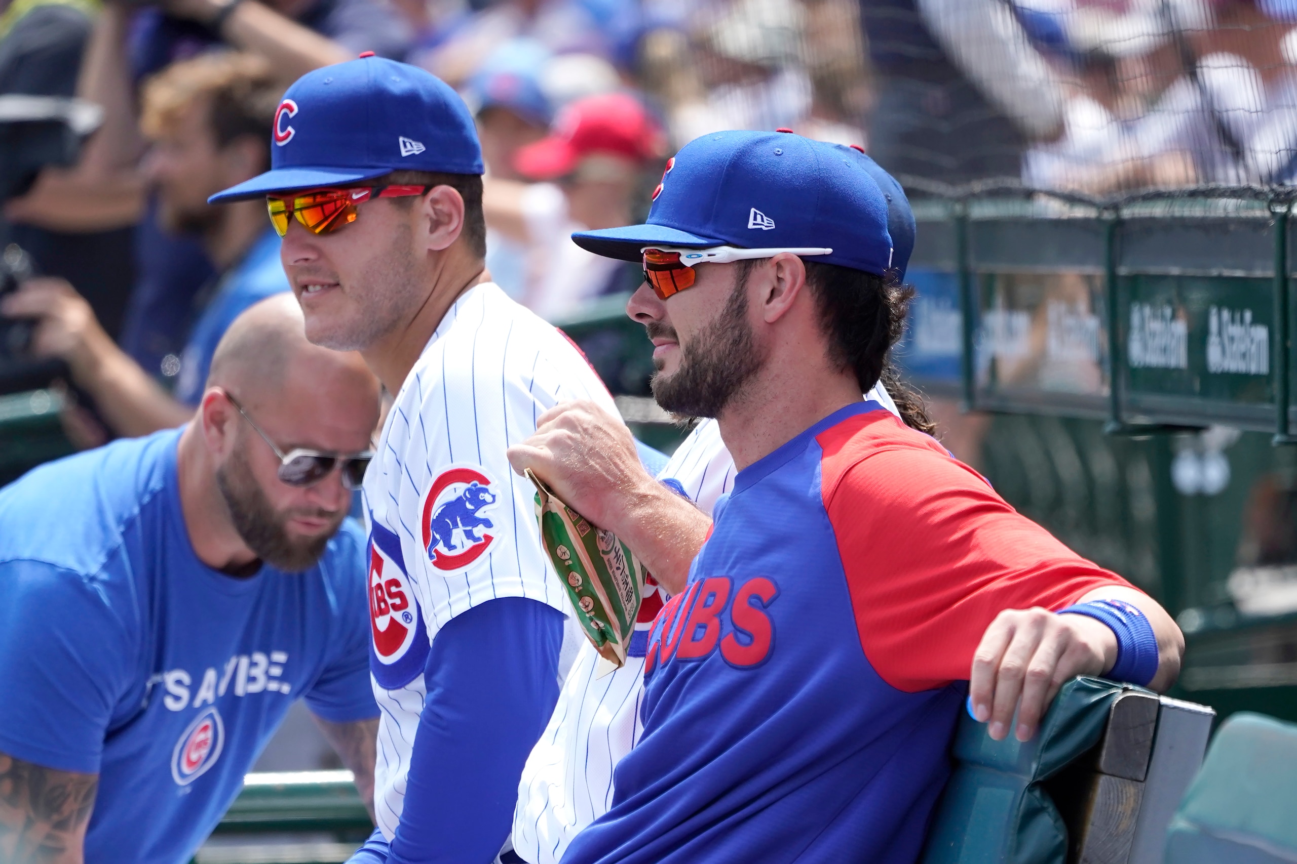 Chicago Cubs' Anthony Rizzo, left, and Kris Bryant sit near each other on the bench before a baseball game against the Cincinnati Reds Thursday, July 29, 2021, in Chicago. Manager David Ross gave both the players the day off. (AP Photo/Charles Rex Arbogast)