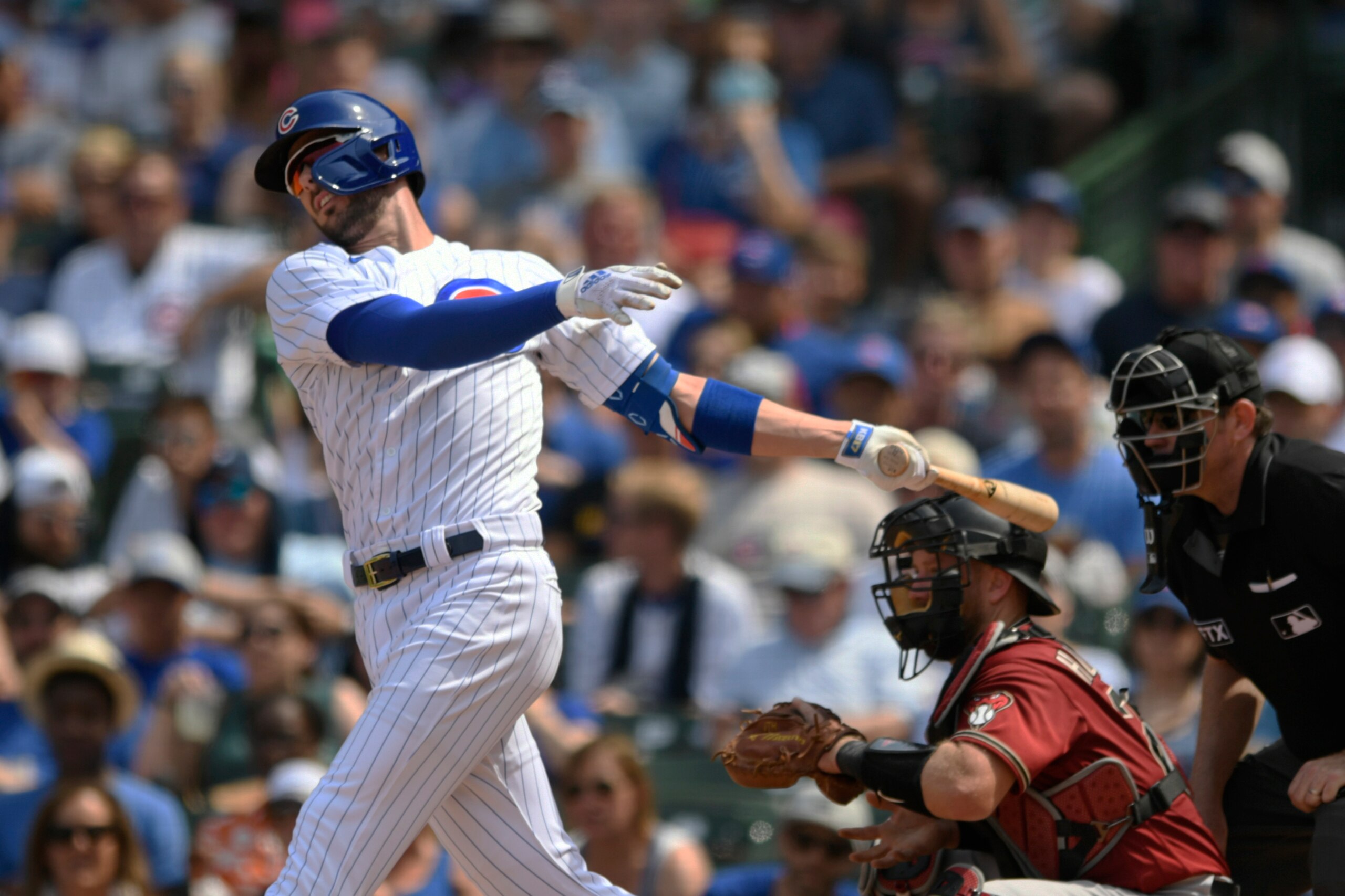 Chicago Cubs' Kris Bryant strikes out during the fifth inning of a baseball game against the Arizona Diamondbacks Sunday, July 25, 2021, in Chicago. Chicago won 5-1. (AP Photo/Paul Beaty)