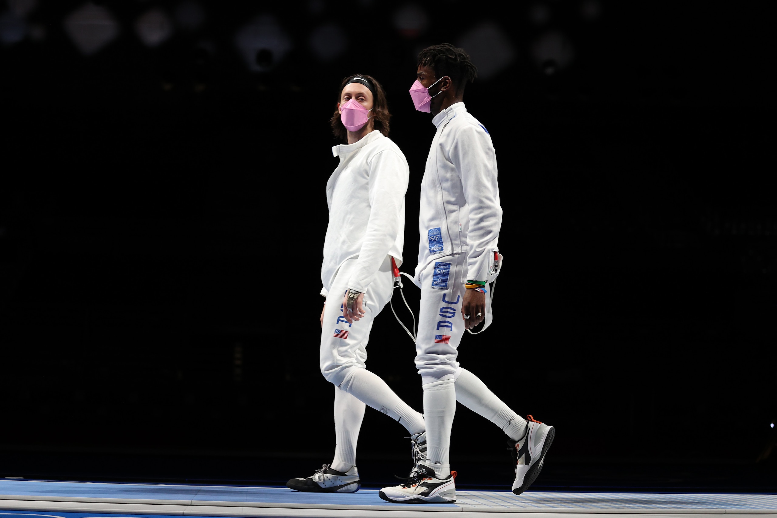 CHIBA, JAPAN - JULY 30: Jacob Hoyle of Team United States, left, and Curtis McDowald of Team United States react to their loss to Team Japan in Men's Épée Team Table of 16 on day seven of the Tokyo 2020 Olympic Games at Makuhari Messe Hall on July 30, 2021 in Chiba, Japan. (Photo by Elsa/Getty Images)