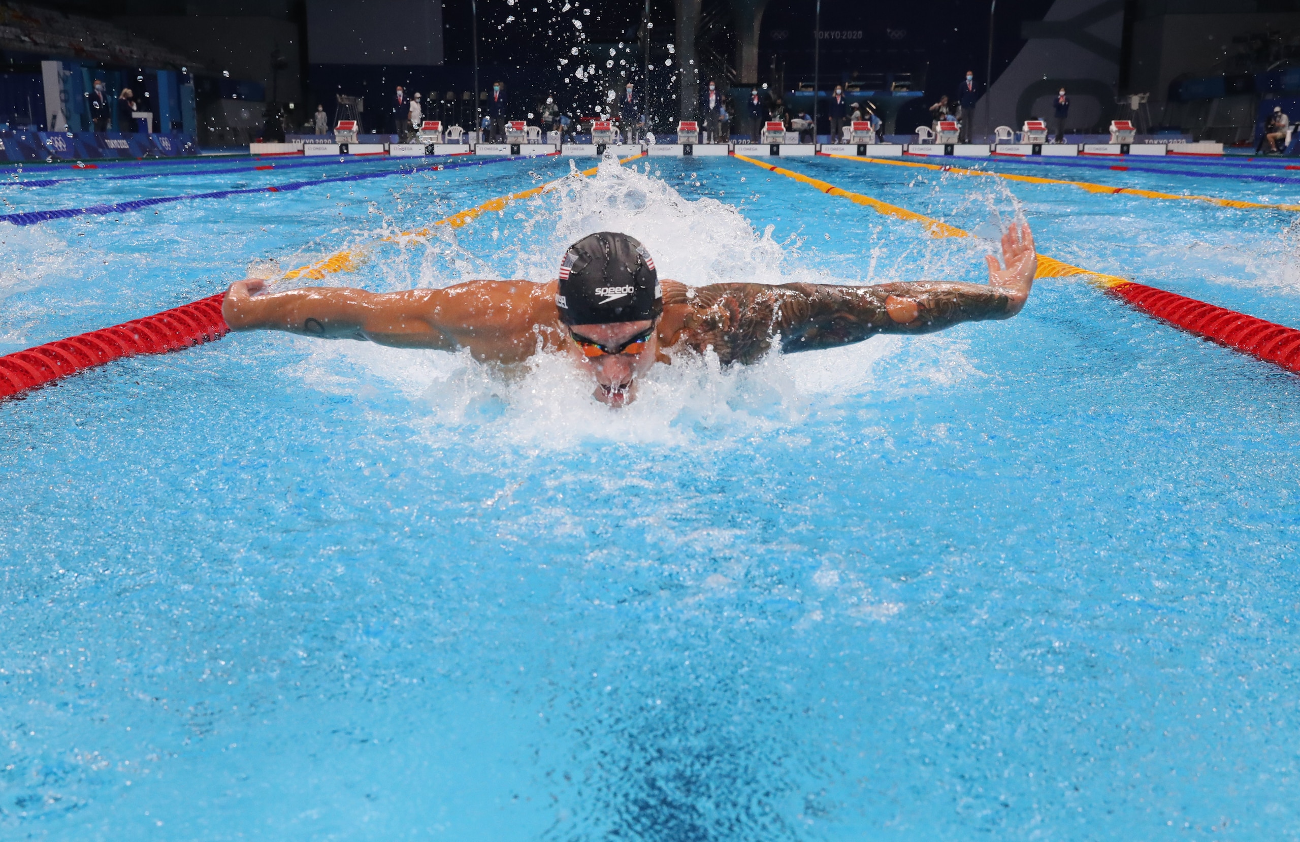 TOKYO, JAPAN - JULY 30: Caeleb Dressel of Team United States (R) competes in the second Semifinal of the Men's 100m Butterfly  on day seven of the Tokyo 2020 Olympic Games at Tokyo Aquatics Centre on July 30, 2021 in Tokyo, Japan. (Photo by Maddie Meyer/Getty Images)