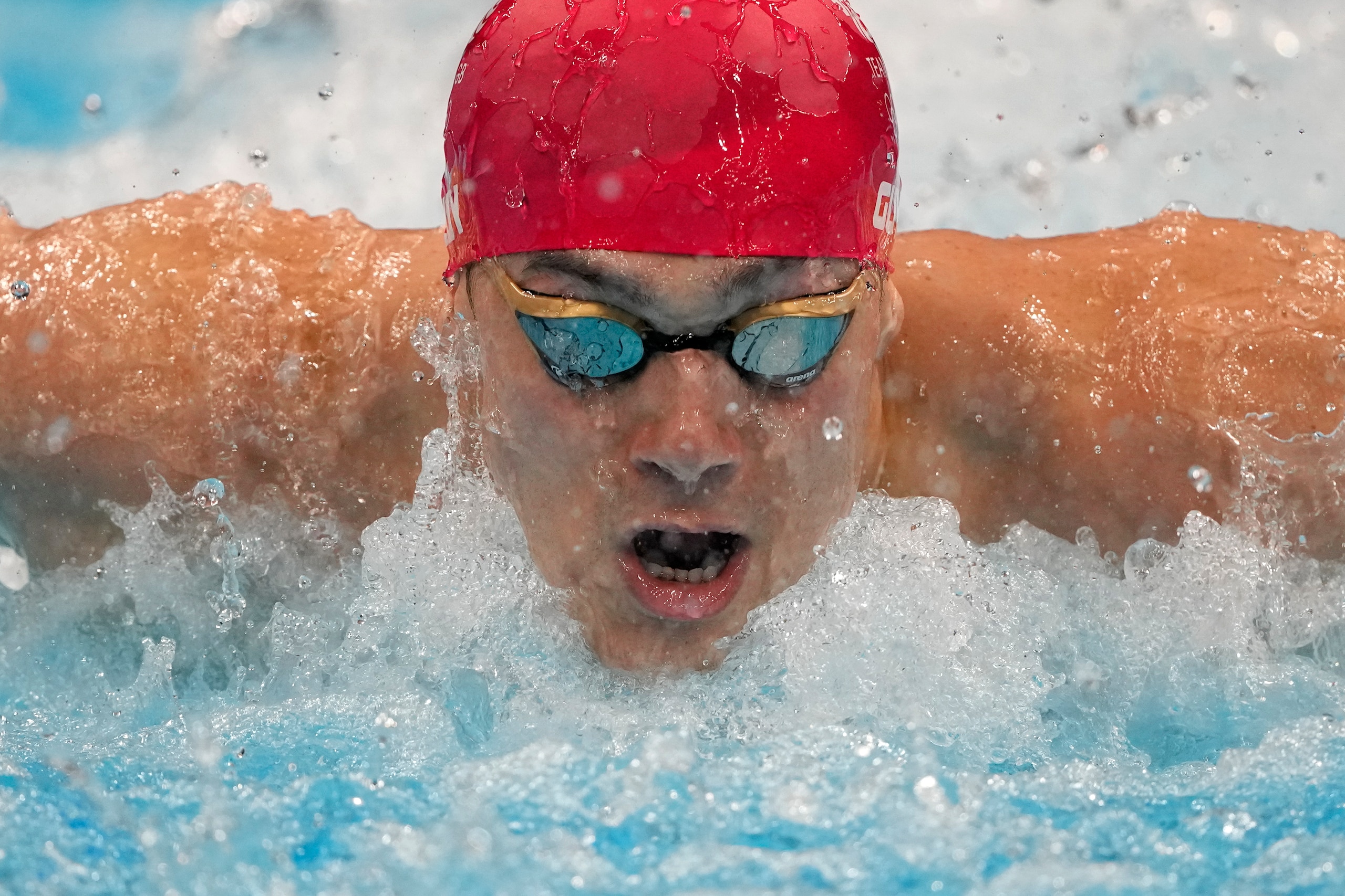 James Guy, of Britain, swims in a men's 4x100-meter medley relay heat at the 2020 Summer Olympics, Friday, July 30, 2021, in Tokyo, Japan. (AP Photo/Gregory Bull)