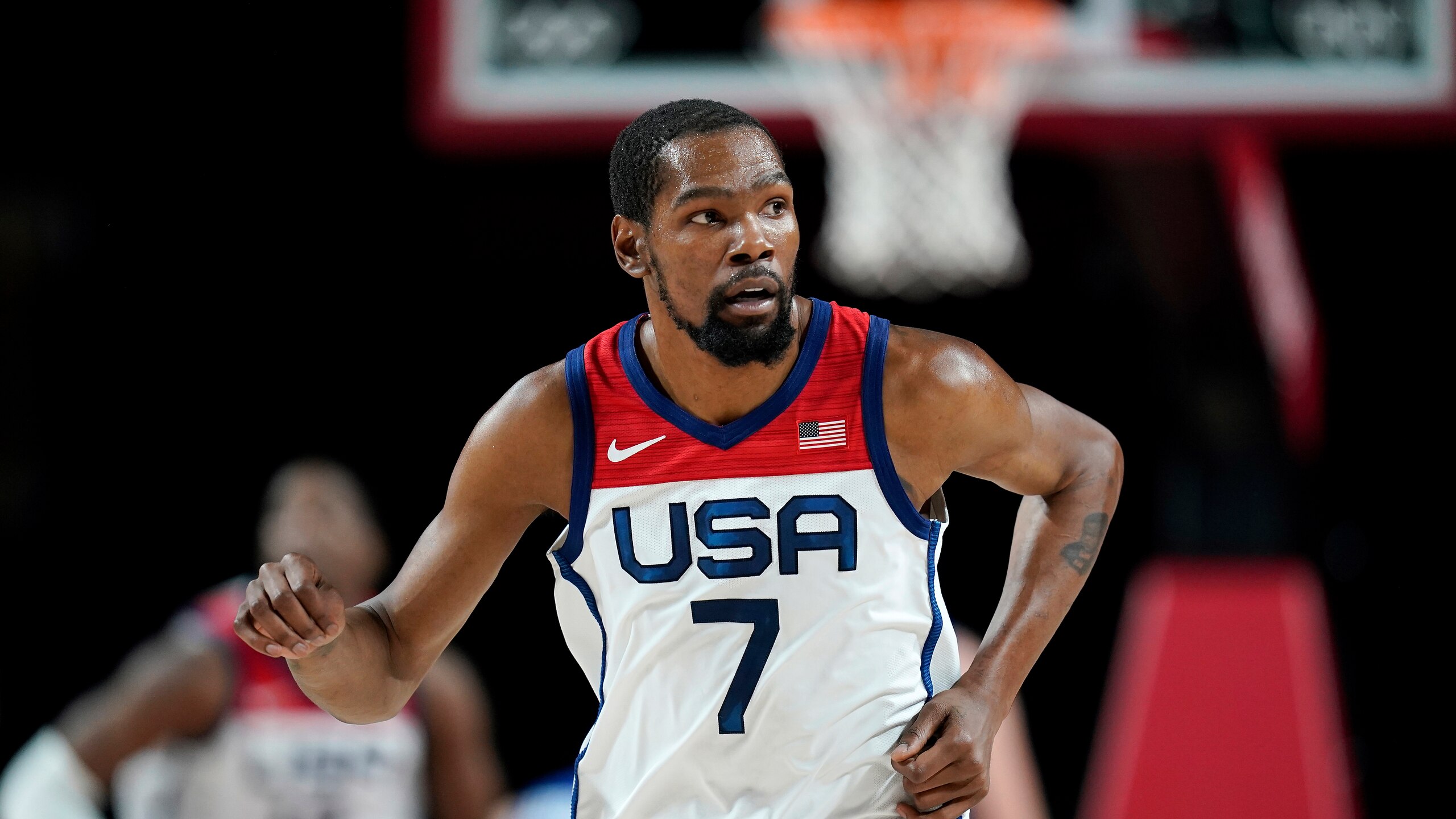 United States's Kevin Durant (7) runs up court after making a 3-point basket during a men's basketball preliminary round game against the Czech Republic at the 2020 Summer Olympics, Saturday, July 31, 2021, in Saitama, Japan. (AP Photo/Charlie Neibergall)