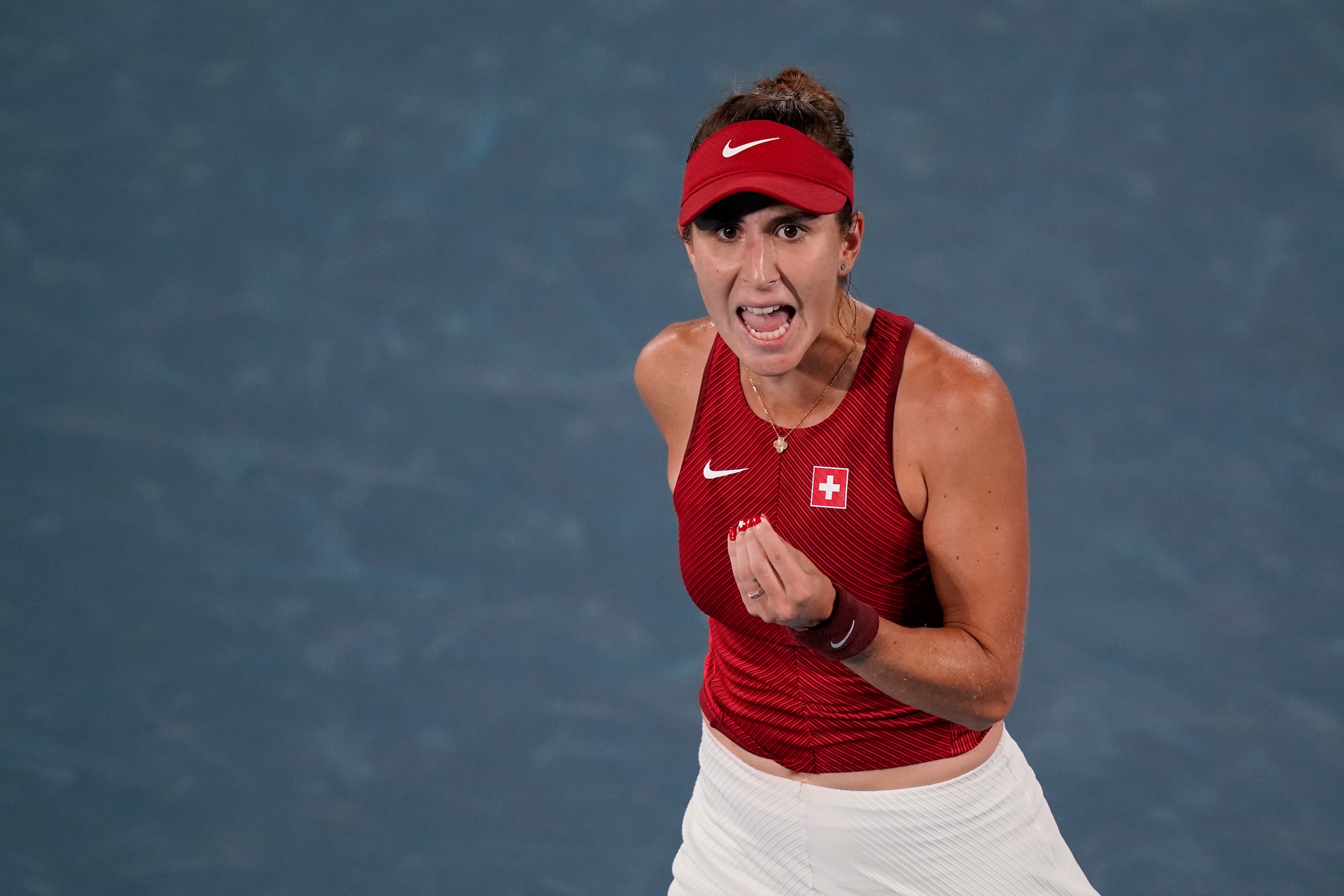 Belinda Bencic, of Switzerland, yells during the women's gold medal match of the tennis competition against Marketa Vondrousova, of the Czech Republic, at the 2020 Summer Olympics, Saturday, July 31, 2021, in Tokyo, Japan. (AP Photo/Patrick Semansky) Belinda Bencic, of Switzerland, yells during the women's gold medal match of the tennis competition against Marketa Vondrousova, of the Czech Republic, at the 2020 Summer Olympics, Saturday, July 31, 2021, in Tokyo, Japan. (AP Photo/Patrick Semansky)