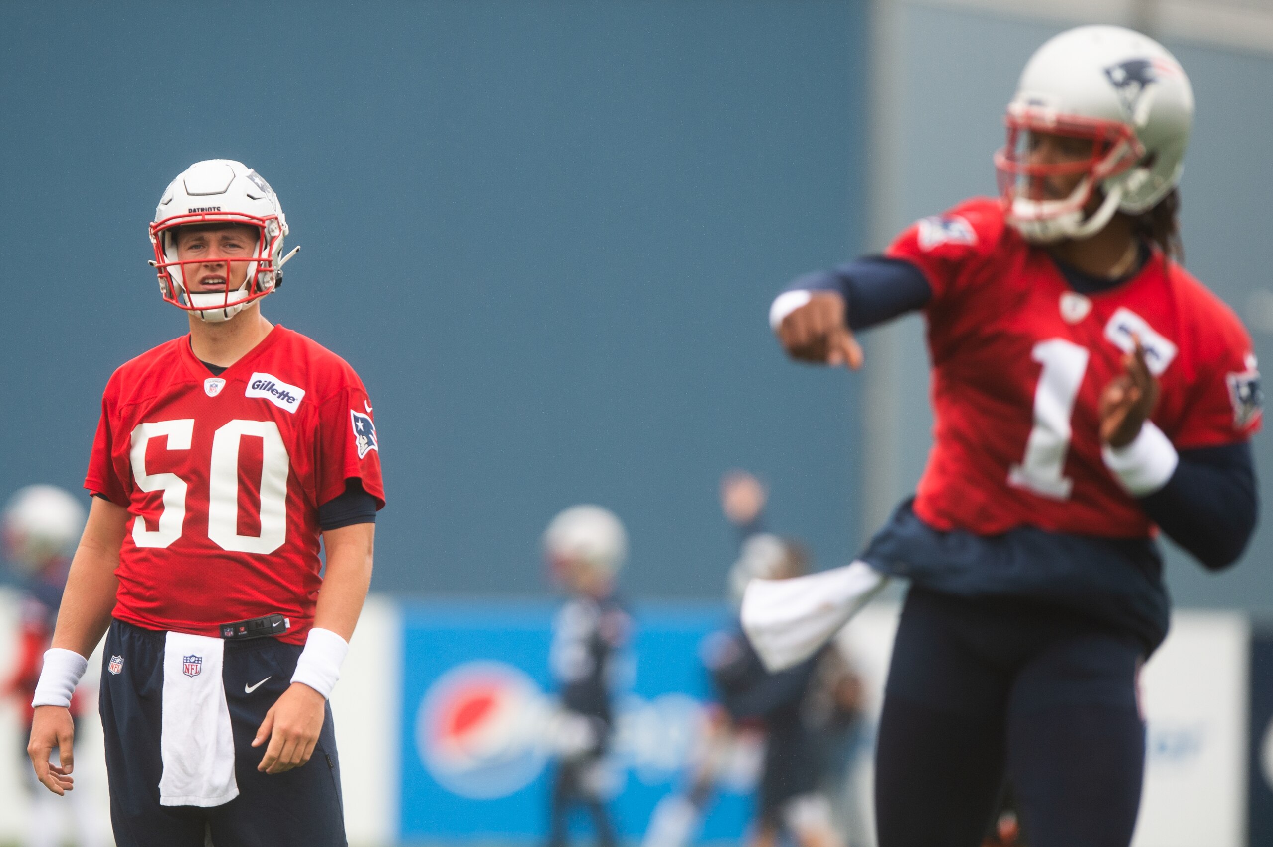 FOXBOROUGH, MA - JULY 28, 2021: Mac Jones #50 watches teammate Cam Newton #1 of the New England Patriots during training camp at Gillette Stadium on July 28, 2021 in Foxborough, Massachusetts. (Photo by Kathryn Riley/Getty Images) FOXBOROUGH, MA - JULY 28, 2021: Mac Jones #50 watches teammate Cam Newton #1 of the New England Patriots during training camp at Gillette Stadium on July 28, 2021 in Foxborough, Massachusetts. (Photo by Kathryn Riley/Getty Images)
