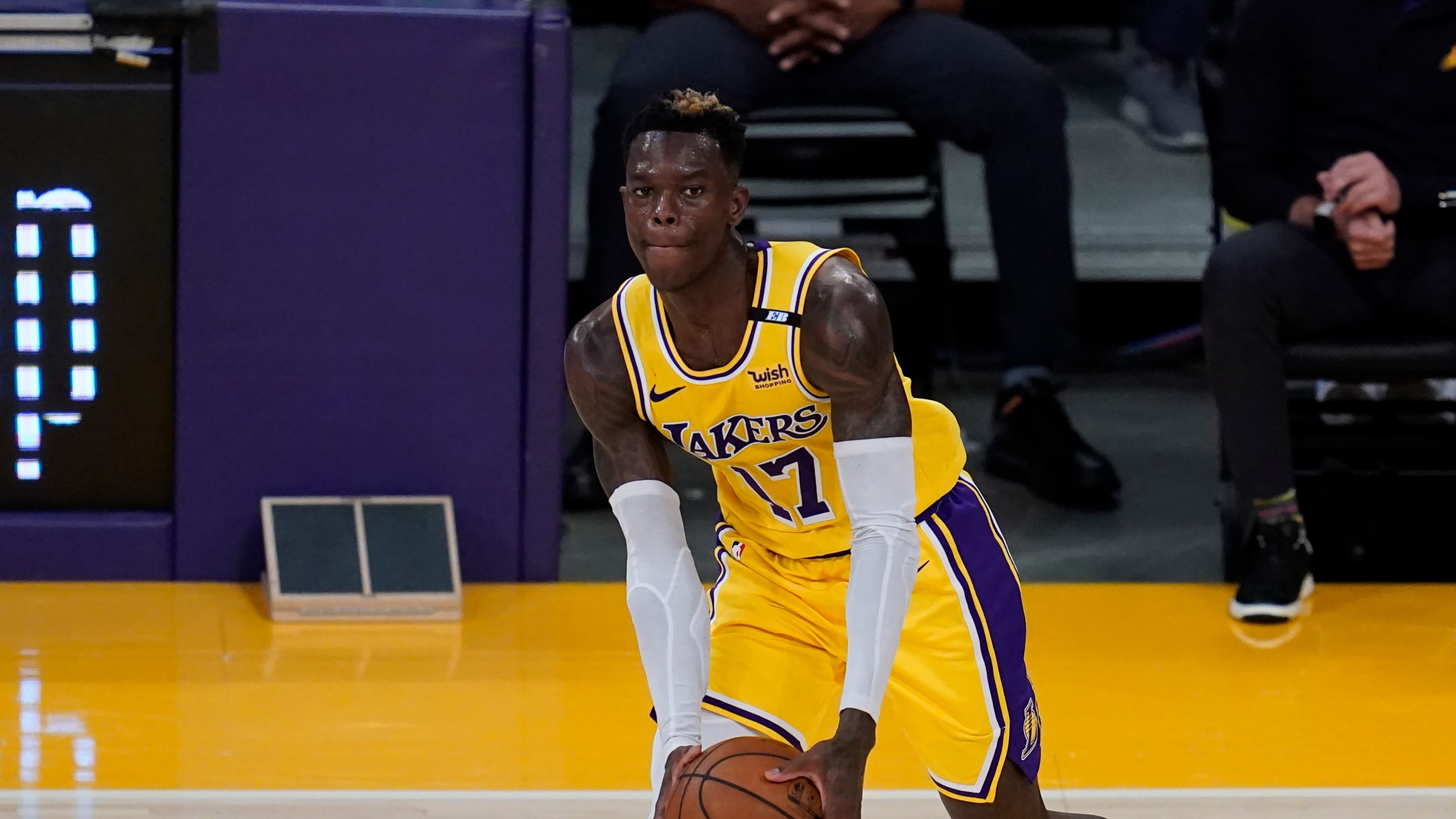 Los Angeles Lakers guard Dennis Schroder (17) controls the ball during Game 6 of an NBA basketball first-round playoff series against the Phoenix Suns Thursday, Jun 3, 2021, in Los Angeles. (AP Photo/Ashley Landis)