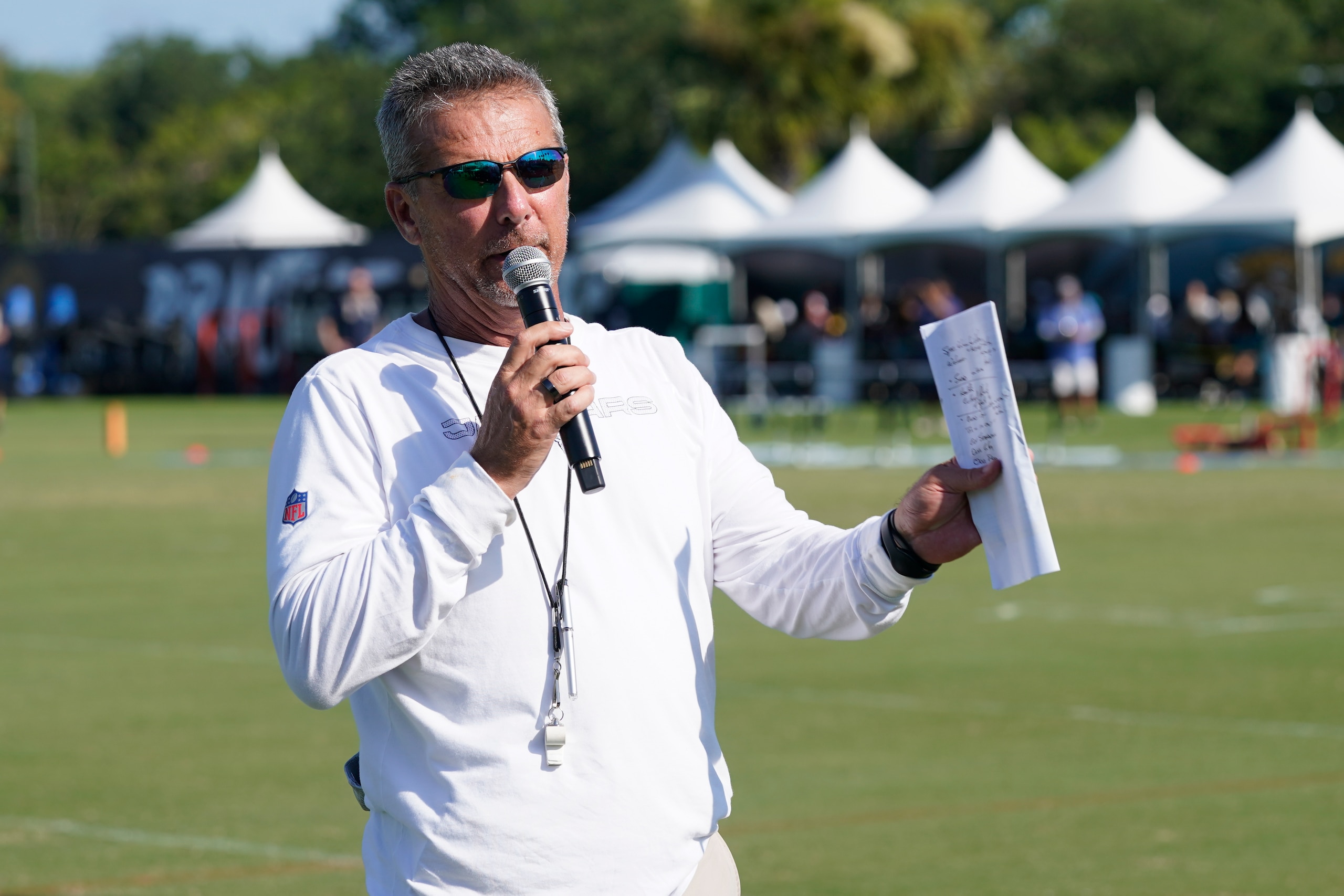 Jacksonville Jaguars head coach Urban Meyer makes remarks to fans before an NFL football practice, Saturday, July 31, 2021, in Jacksonville, Fla. (AP Photo/John Raoux)
