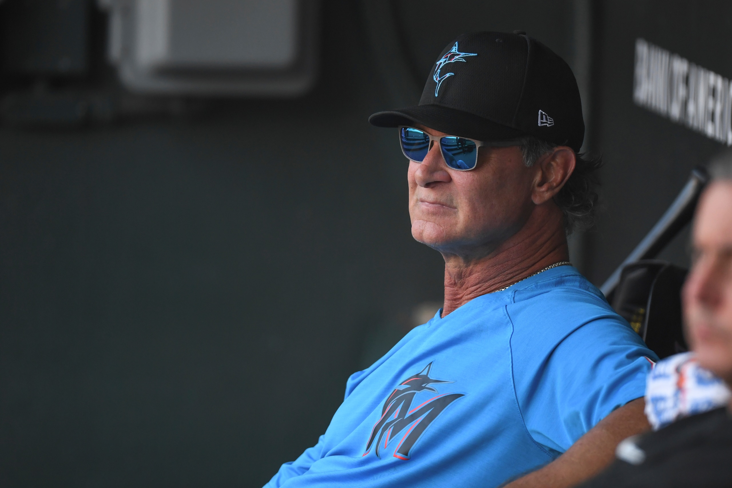 Miami Marlins manager Don Mattingly looks from the dugout before a baseball game against the Baltimore Orioles Tuesday, July 27, 2021, in Baltimore. (AP Photo/Terrance Williams)