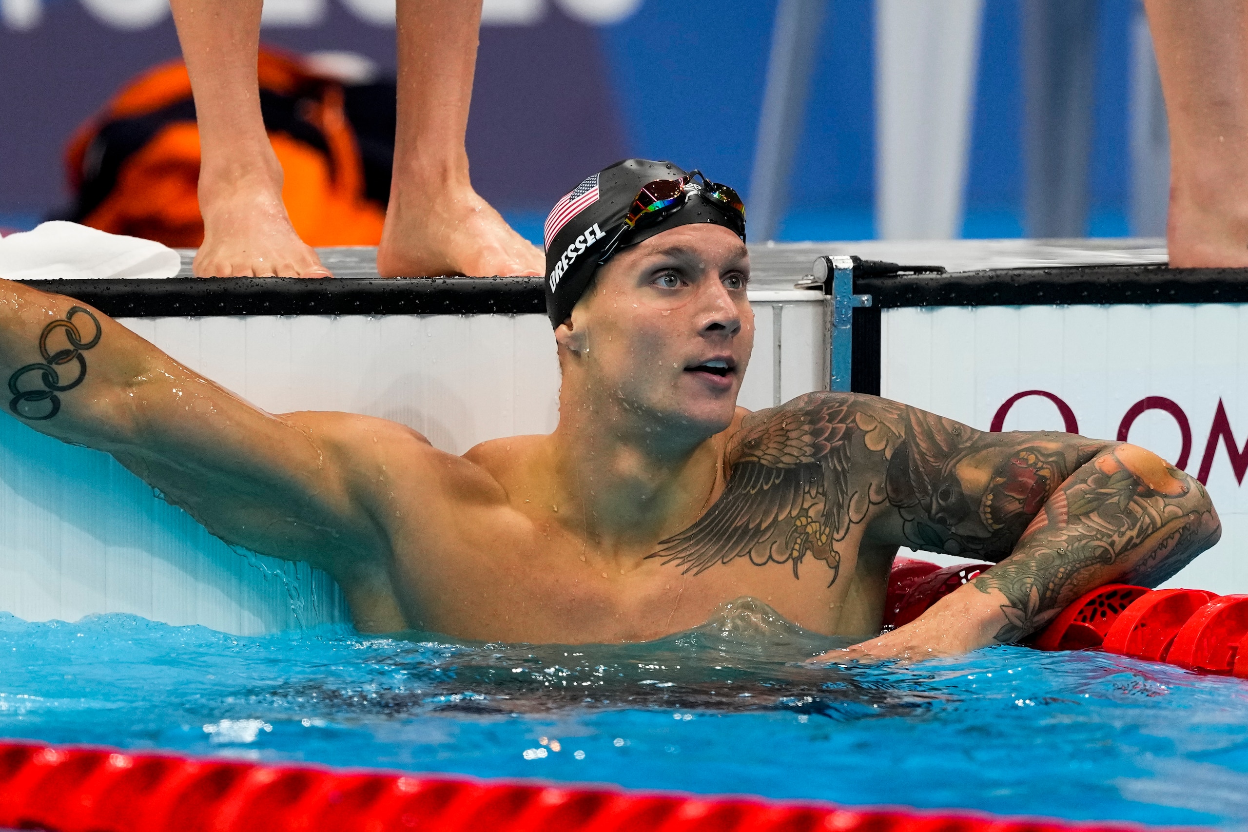 Caeleb Dressel, of United States, looks at the board after finishing a mixed 4x100-meter medley relayat the 2020 Summer Olympics, Saturday, July 31, 2021, in Tokyo, Japan. (AP Photo/Jae C. Hong)