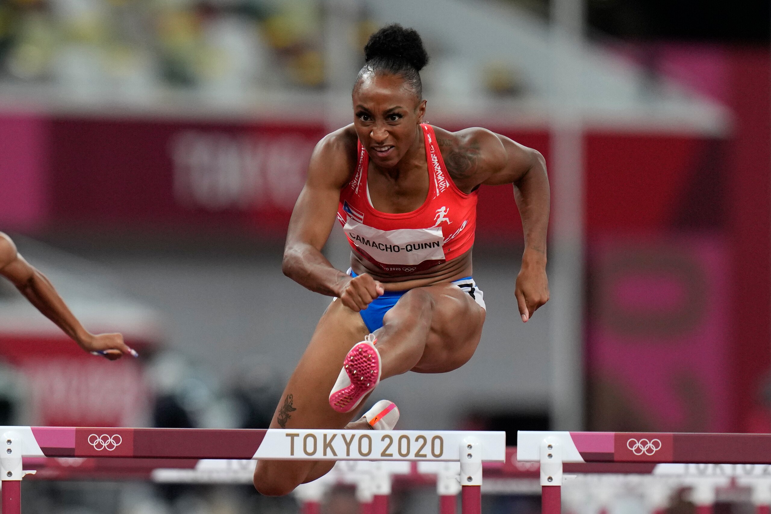 Jasmine Camacho-Quinn, of Puerto Rico, wins a women's 100-meter hurdles semifinal at the 2020 Summer Olympics, Sunday, Aug. 1, 2021, in Tokyo. (AP Photo/Petr David Josek)