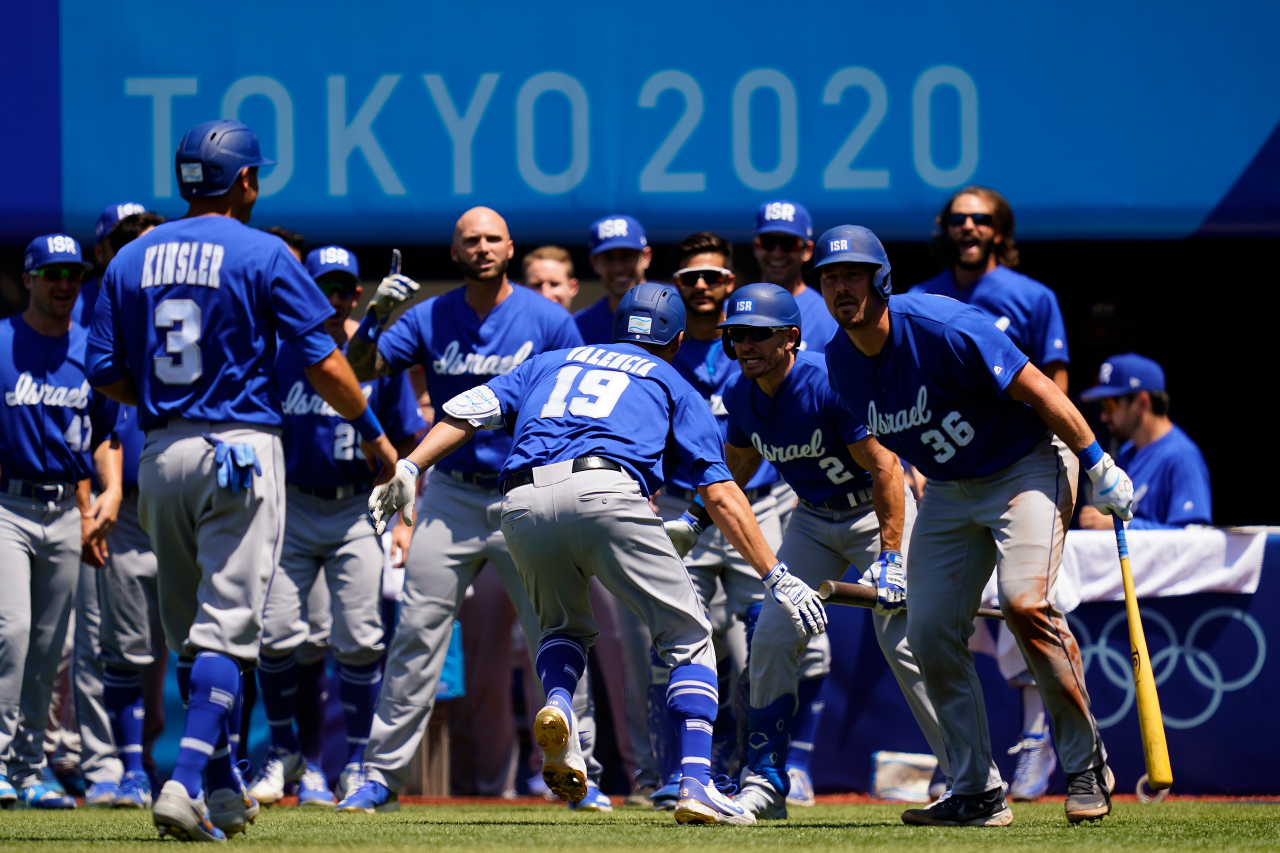 Israel's Danny Valencia (19) celebrates with his teammates after hitting a three-run home run during a baseball game against Mexico at Yokohama Baseball Stadium during the 2020 Summer Olympics, Sunday, Aug. 1, 2021, in Yokohama, Japan. (AP Photo/Matt Slocum)