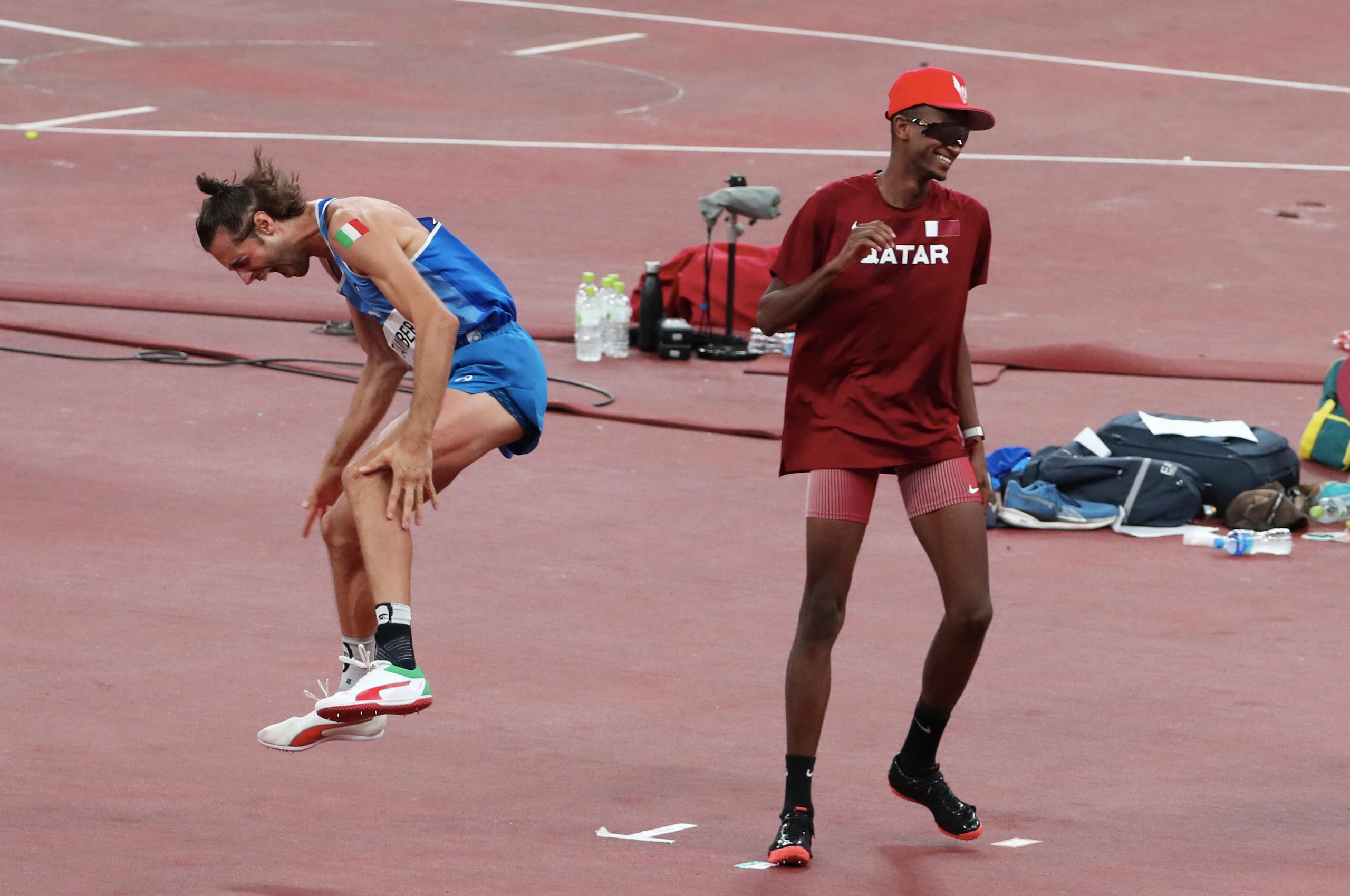 TOKYO, JAPAN - AUGUST 01: Gianmarco Tamberi of Team Italy celebrates after agreeing to share gold with Mutaz Essa Barshim of Team Qatar in the Men's High Jump Final on day nine of the Tokyo 2020 Olympic Games at Olympic Stadium on August 01, 2021 in Tokyo, Japan. (Photo by Xavier Laine/Getty Images)
