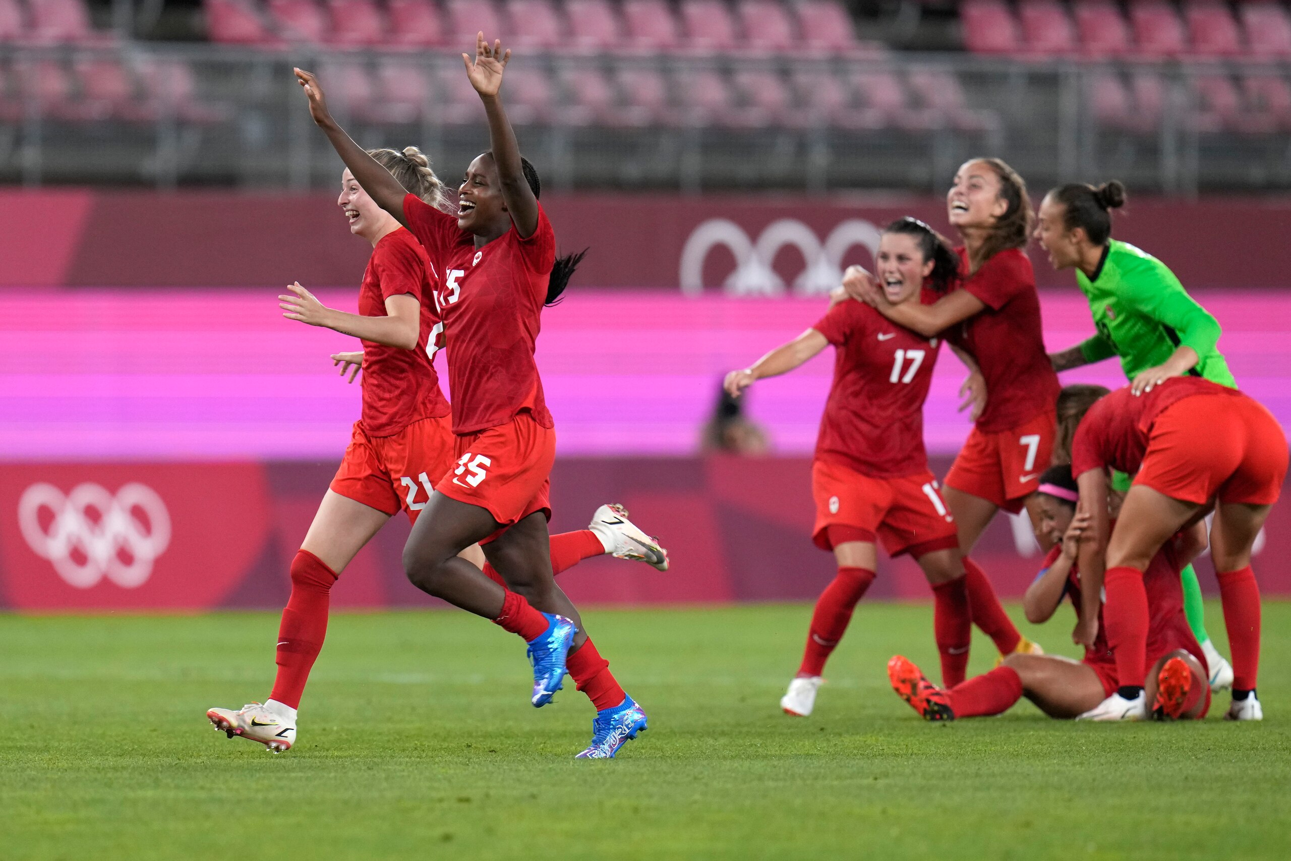 Canada's players celebrate after winning 1-0 to United States during a women's semifinal soccer match at the 2020 Summer Olympics, Monday, Aug. 2, 2021, in Kashima, Japan. (AP Photo/Fernando Vergara)