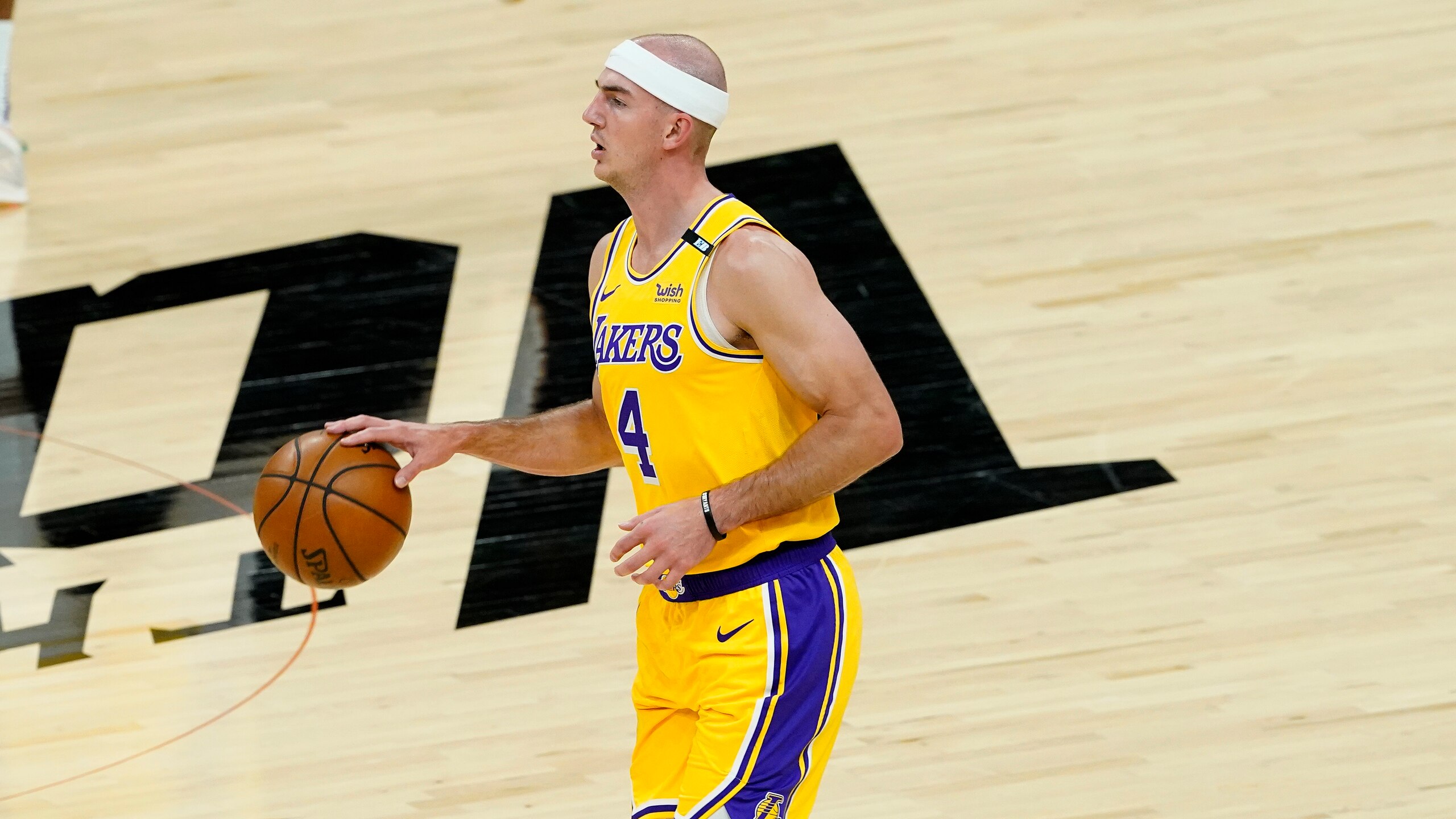 Los Angeles Lakers guard Alex Caruso (4) against the Phoenix Suns during the first half of Game 5 of an NBA basketball first-round playoff series against the Phoenix Suns, Tuesday, June 1, 2021, in Phoenix. (AP Photo/Matt York)