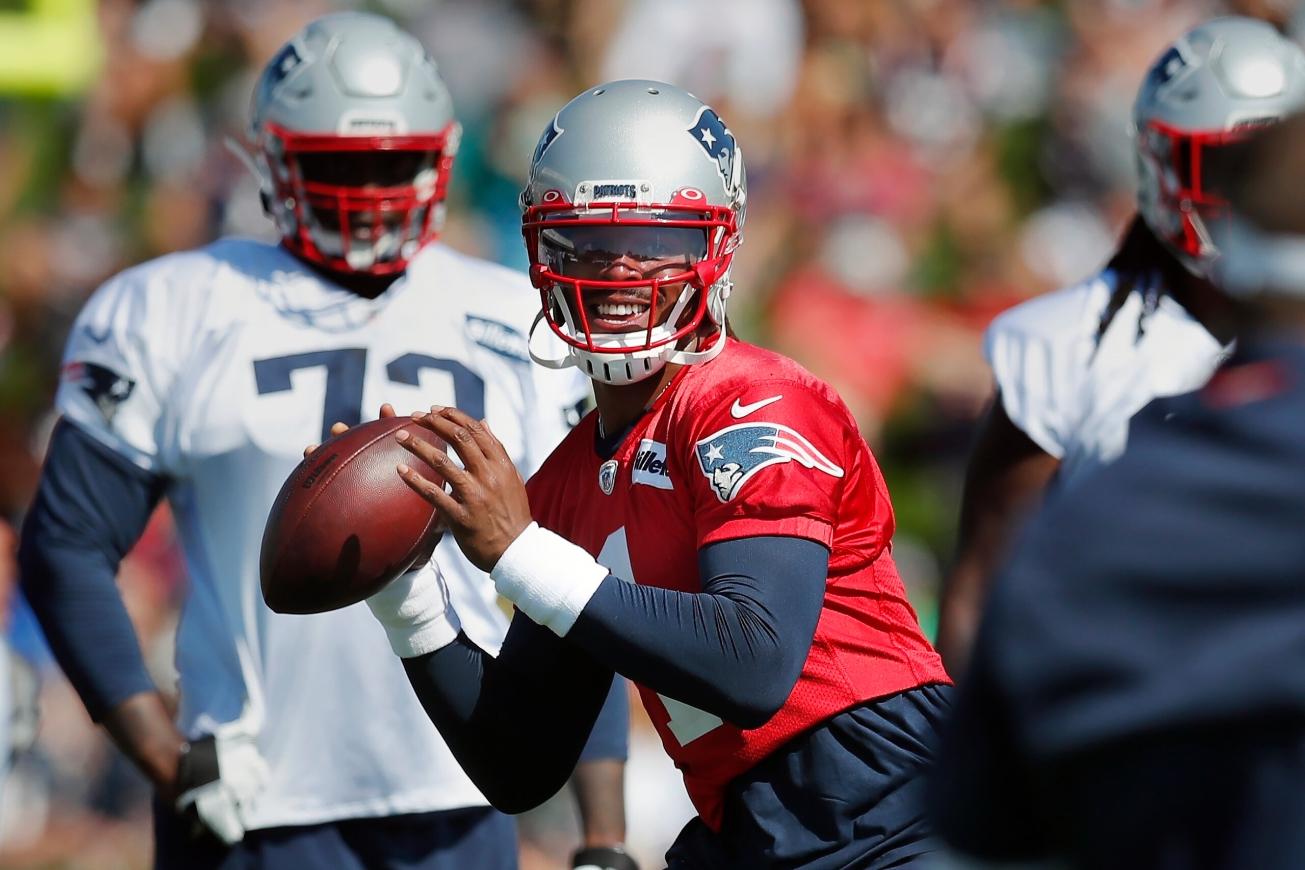 New England Patriots quarterback Cam Newton takes part in a drill during an NFL football practice, Saturday, July 31, 2021, in Foxborough, Mass. (AP Photo/Michael Dwyer) New England Patriots quarterback Cam Newton takes part in a drill during an NFL football practice, Saturday, July 31, 2021, in Foxborough, Mass. (AP Photo/Michael Dwyer)