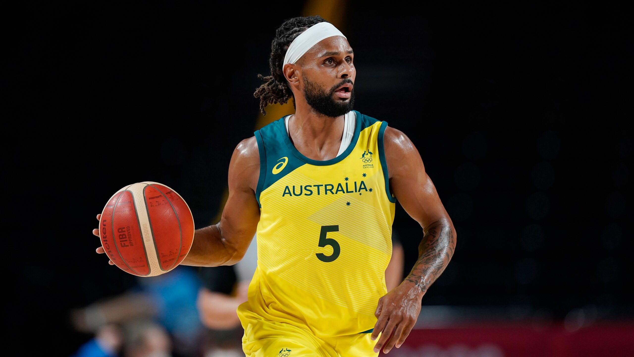Australia's Patty Mills (5) during a men's basketball preliminary round game against Germany at the 2020 Summer Olympics, Saturday, July 31, 2021, in Saitama, Japan. (AP Photo/Eric Gay)