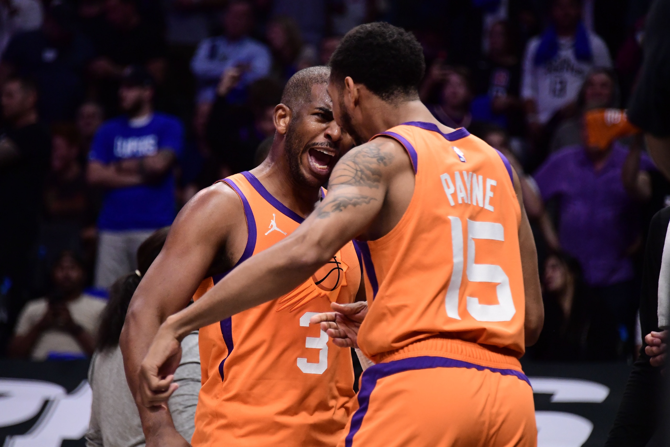 LOS ANGELES, CA - JUNE 30: Chris Paul #3 celebrates with Cameron Payne #15 of the Phoenix Suns during Game 6 of the Western Conference Finals of the 2021 NBA Playoffs on June 30, 2021 at STAPLES Center in Los Angeles, California. NOTE TO USER: User expressly acknowledges and agrees that, by downloading and/or using this Photograph, user is consenting to the terms and conditions of the Getty Images License Agreement. Mandatory Copyright Notice: Copyright 2021 NBAE (Photo by Adam Pantozzi/NBAE via Getty Images)