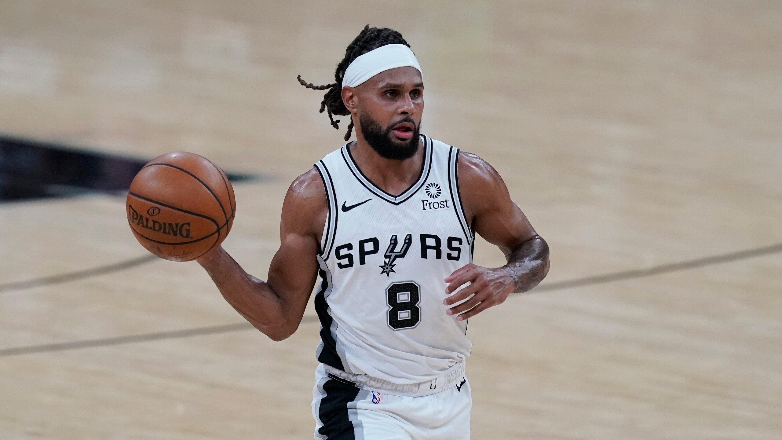 San Antonio Spurs guard Patty Mills (8) during the second half of an NBA basketball game against the Phoenix Suns in San Antonio, Saturday, May 15, 2021. (AP Photo/Eric Gay) San Antonio Spurs guard Patty Mills (8) during the second half of an NBA basketball game against the Phoenix Suns in San Antonio, Saturday, May 15, 2021. (AP Photo/Eric Gay)
