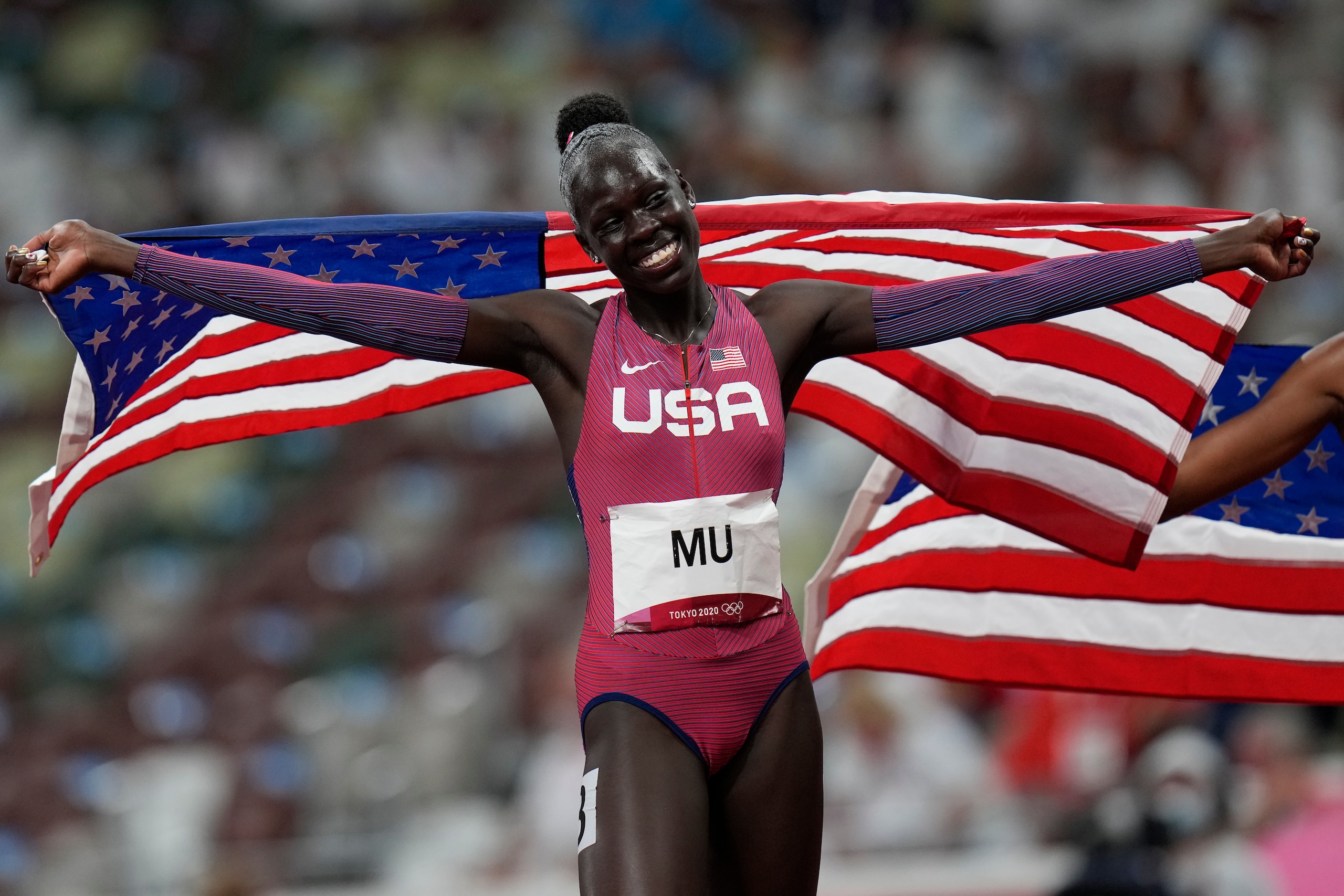 Athing Mu, of United States, reacts after winning the final of the women's 800-meters at the 2020 Summer Olympics, Tuesday, Aug. 3, 2021, in Tokyo. (AP Photo/Petr David Josek)
