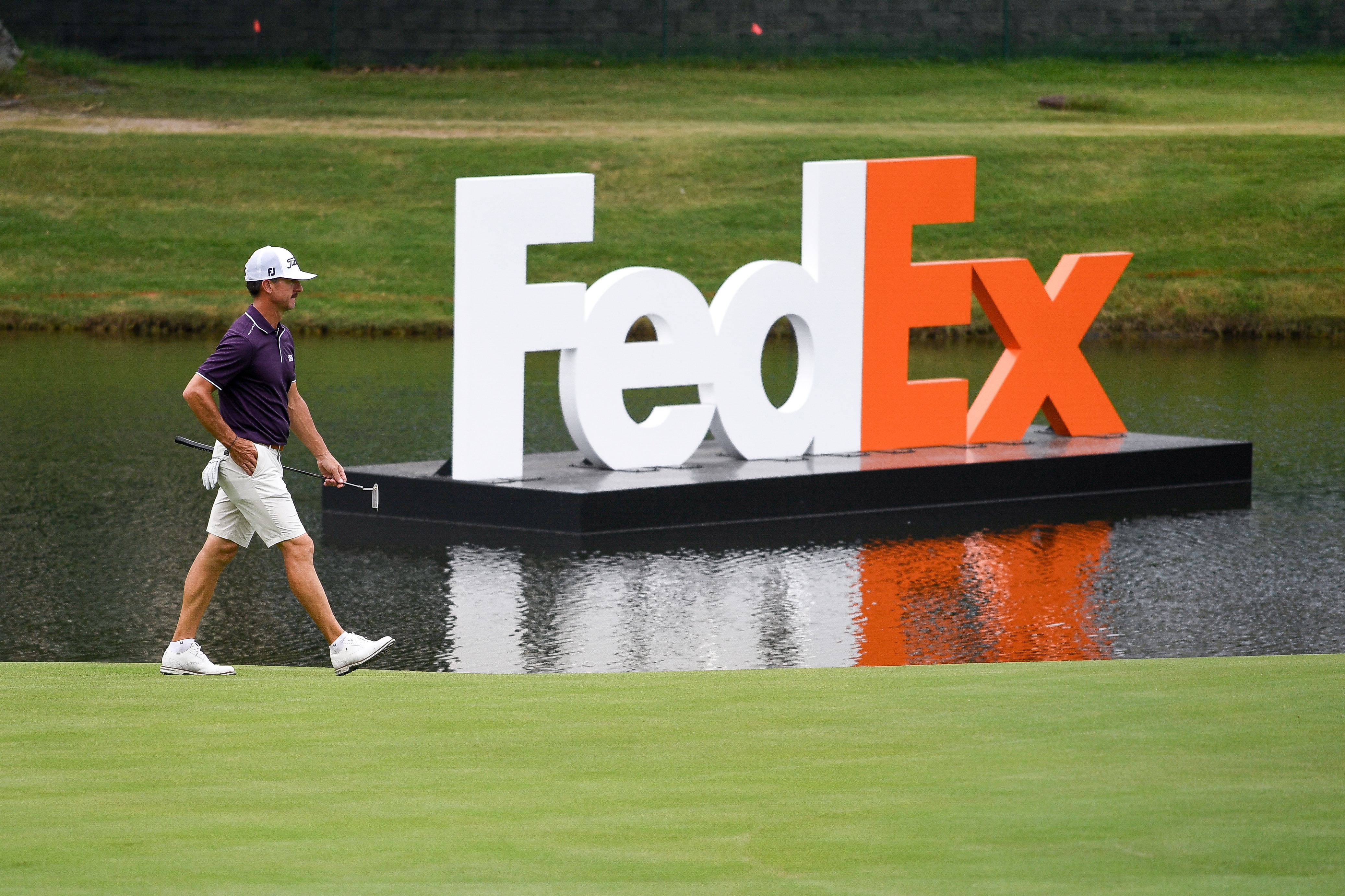 MEMPHIS, TN - AUGUST 02: Wade Ormsby of Australia walks pas giant FedEx letters at the 18th hole prior to the World Golf Championships-FedEx St. Jude Invitational at TPC Southwind on August 2, 2021 in Memphis, Tennessee. (Photo by Tracy Wilcox/PGA TOUR via Getty Images)