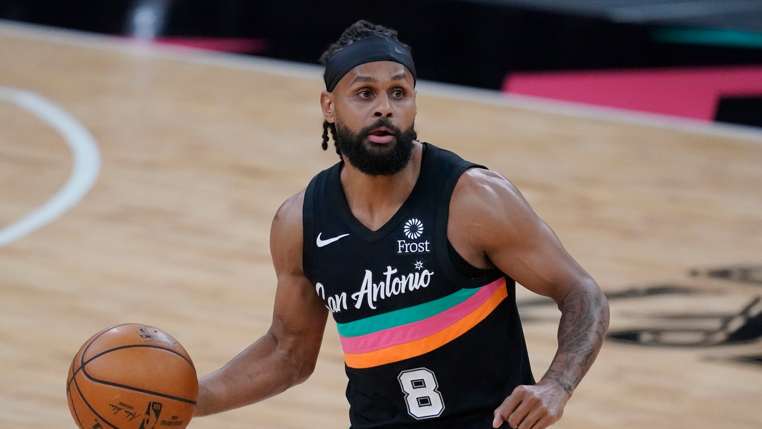 San Antonio Spurs guard Patty Mills (8) during the first half of an NBA basketball game against the Cleveland Cavaliers in San Antonio, Monday, April 5, 2021. (AP Photo/Eric Gay) San Antonio Spurs guard Patty Mills (8) during the first half of an NBA basketball game against the Cleveland Cavaliers in San Antonio, Monday, April 5, 2021. (AP Photo/Eric Gay)