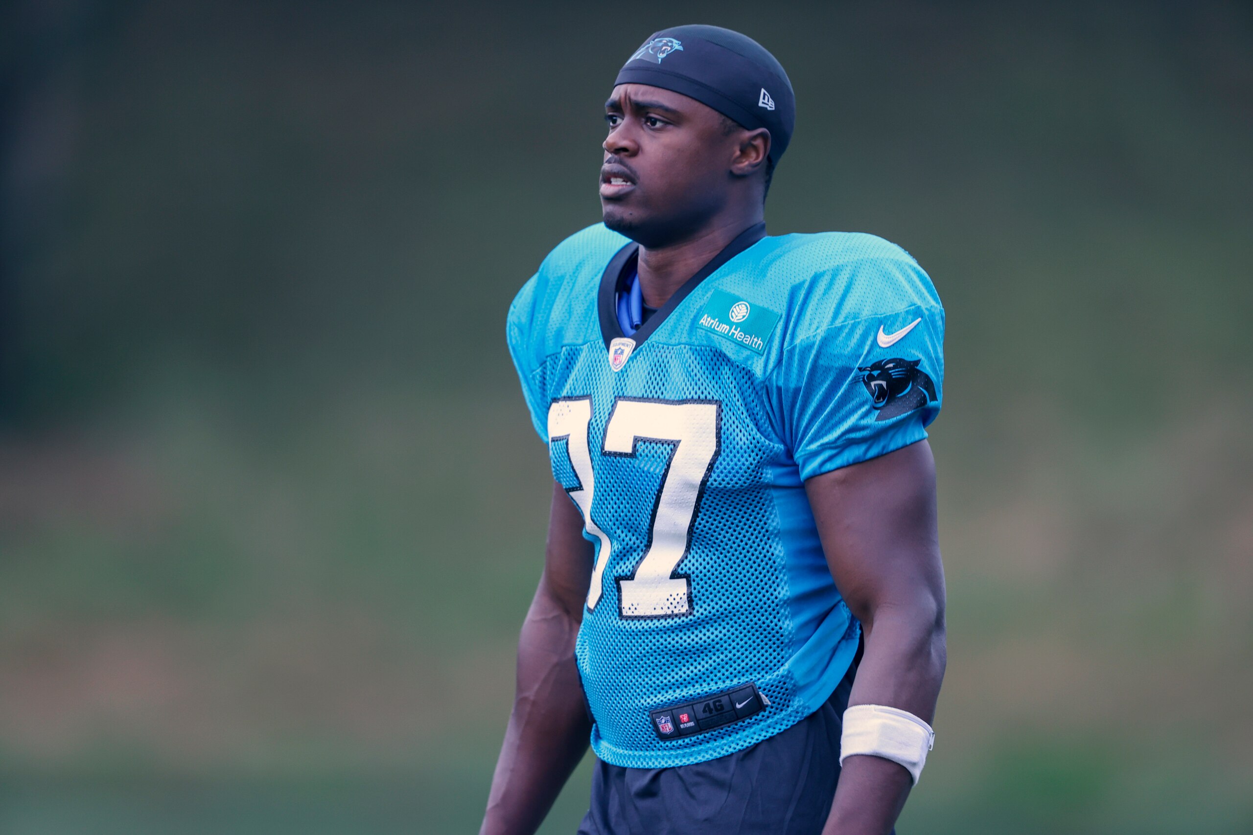 Carolina Panthers defensive back J.T. Ibe walks onto the practice field at the NFL football team's training camp in Spartanburg, S.C., Tuesday, Aug. 3, 2021. Carolina Panthers wide receiver Keith Kirkwood was hit in the neck area during practice Tuesday, carted off the field and taken away in an ambulance. Defensive back J.T. Ibe delivered the hit on a pass play and was immediately kicked out of the team's first padded practice by coach Matt Rhule. (AP Photo/Nell Redmond)