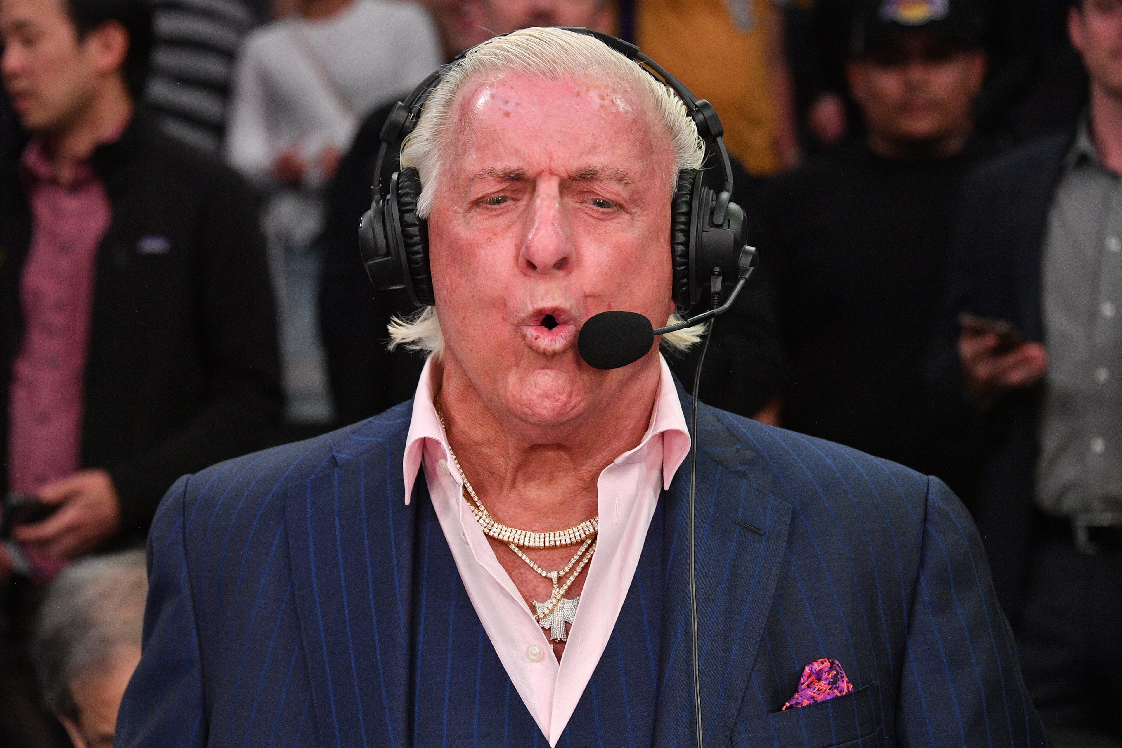 LOS ANGELES, CALIFORNIA - FEBRUARY 25: Ric Flair joins a telecast during a basketball game between the Los Angeles Lakers and the New Orleans Pelicans at Staples Center on February 25, 2020 in Los Angeles, California. (Photo by Allen Berezovsky/Getty Images) LOS ANGELES, CALIFORNIA - FEBRUARY 25: Ric Flair joins a telecast during a basketball game between the Los Angeles Lakers and the New Orleans Pelicans at Staples Center on February 25, 2020 in Los Angeles, California. (Photo by Allen Berezovsky/Getty Images)