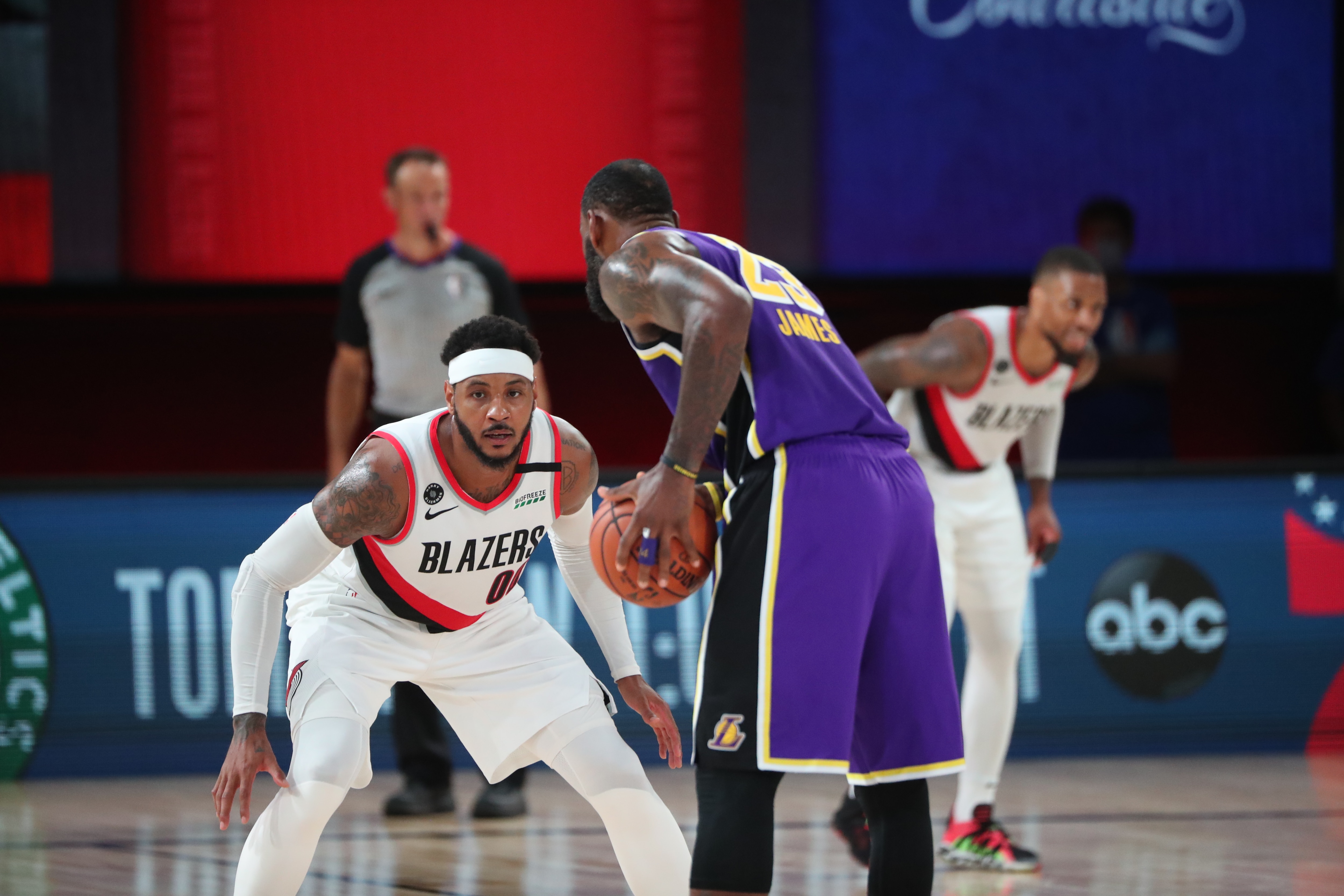 Orlando, FL - AUGUST 22: Carmelo Anthony #00 of the Portland Trail Blazers plays defense against LeBron James #23 of the Los Angeles Lakers during Round One, Game Three on August 22, 2020 in Orlando, Florida at the AdventHealth Arena. NOTE TO USER: User expressly acknowledges and agrees that, by downloading and/or using this Photograph, user is consenting to the terms and conditions of the Getty Images License Agreement. Mandatory Copyright Notice: Copyright 2020 NBAE (Photo by Joe Murphy/NBAE via Getty Images)