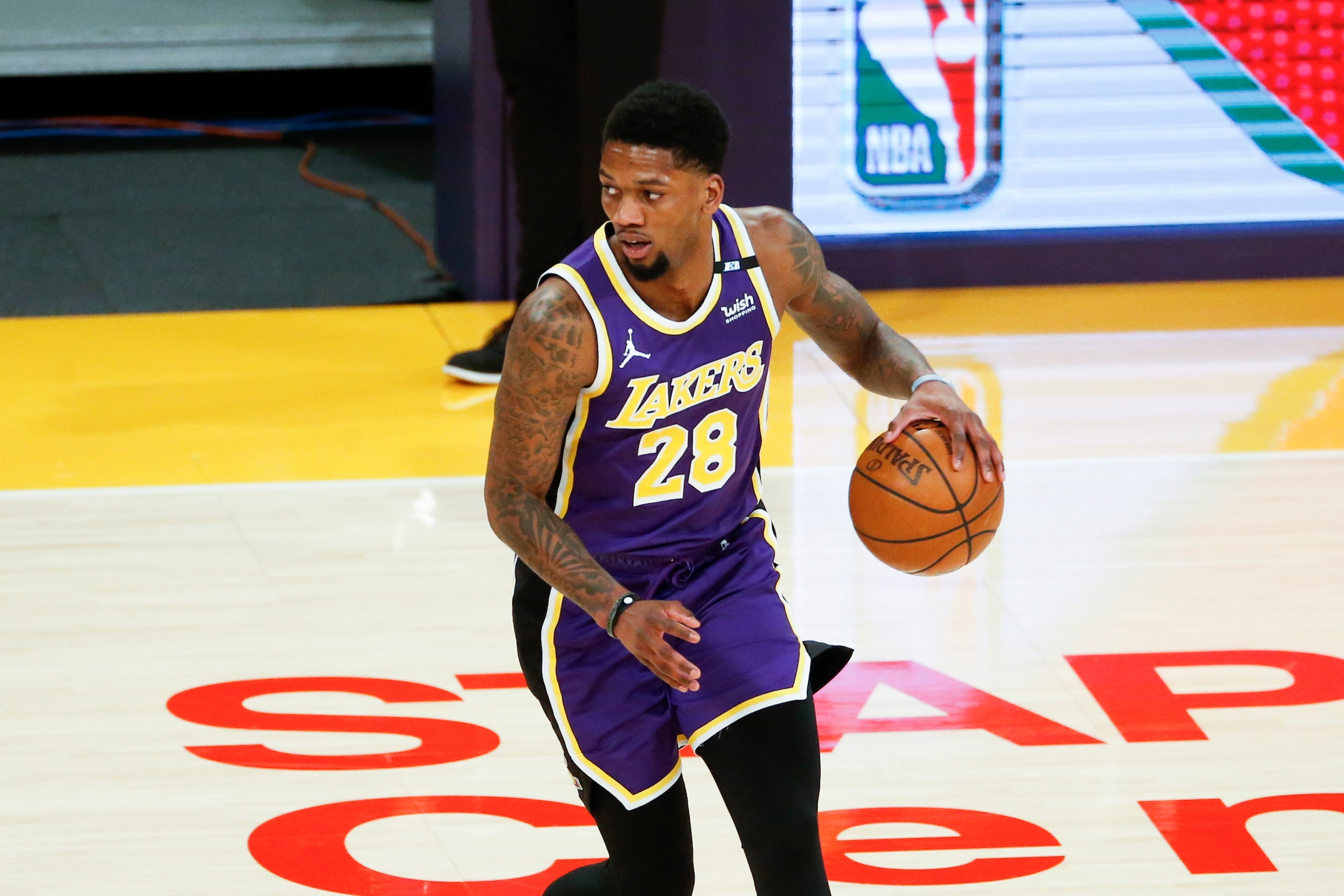 Los Angeles Lakers' Alfonzo McKinnie (28) dribbles against the Boston Celtics during the second half of an NBA basketball game, Thursday, April 15, 2021, in Los Angeles. The Boston Celtics won 121-113. (AP Photo/Ringo H.W. Chiu)