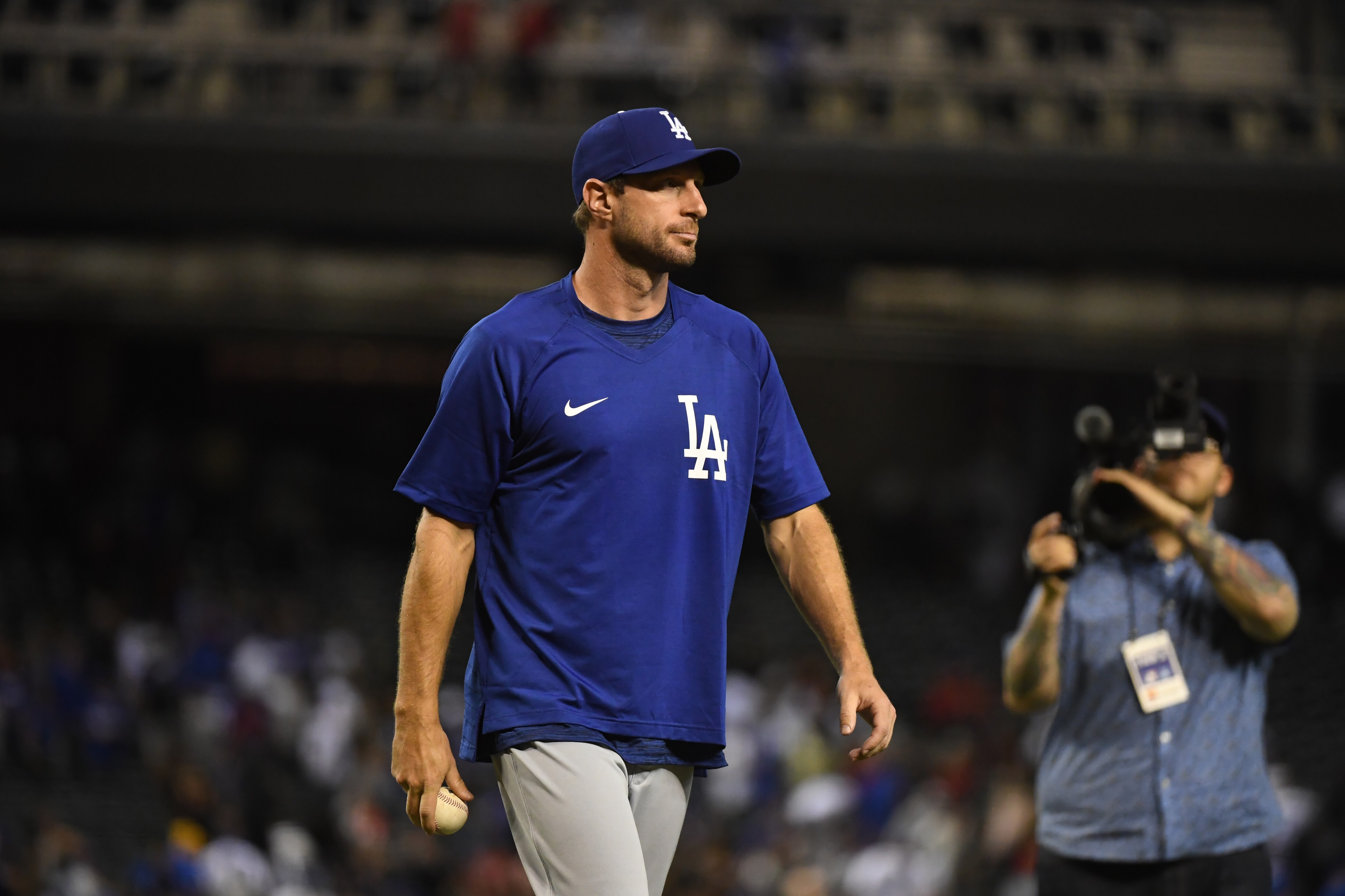 PHOENIX, ARIZONA - JULY 31: Max Scherzer #31 of the Los Angeles Dodgers walks off the field after a game against the Arizona Diamondbacks at Chase Field on July 31, 2021 in Phoenix, Arizona. Dodgers won 8-3. (Photo by Norm Hall/Getty Images)