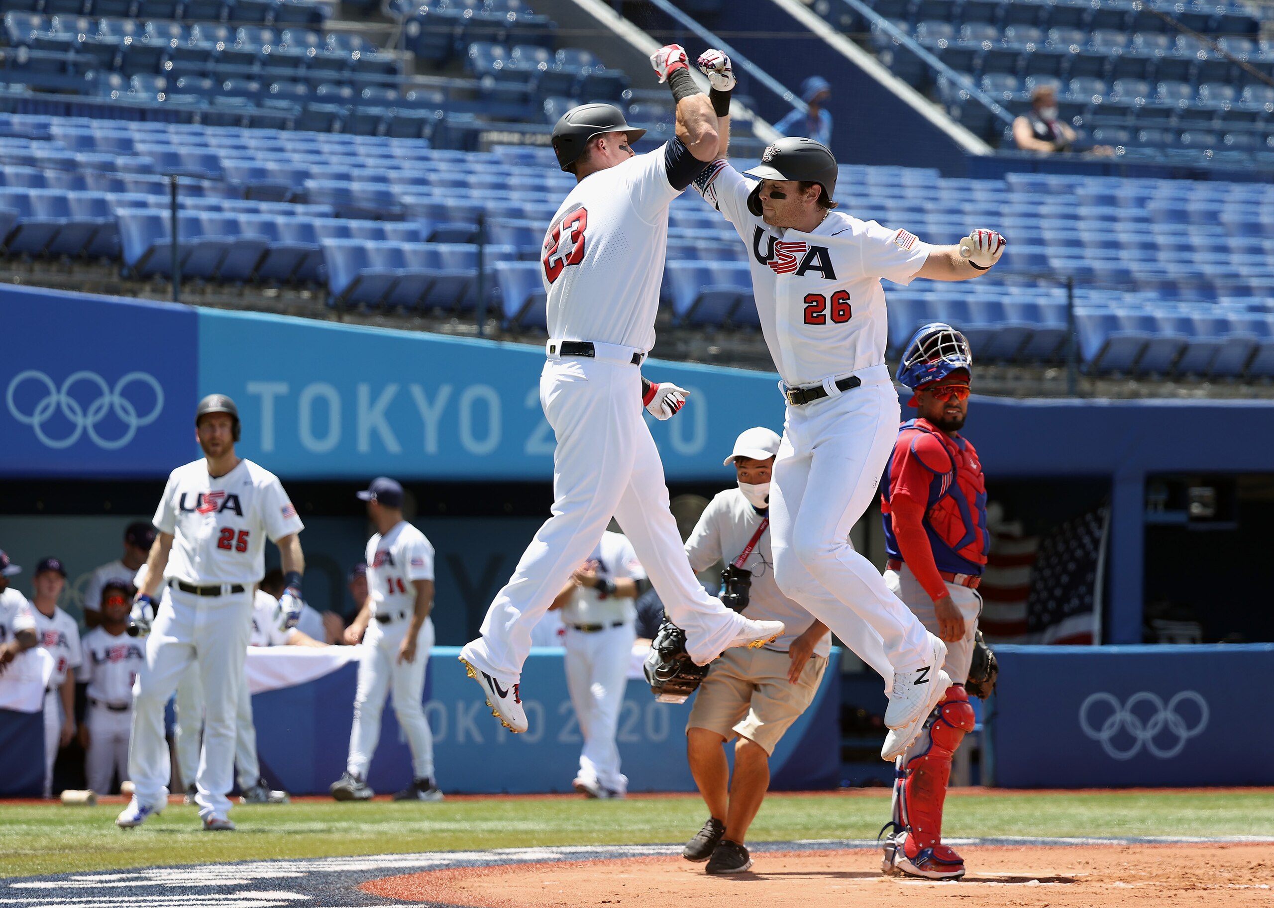 YOKOHAMA, JAPAN - AUGUST 04: Triston Casas #26 and Tyler Austin #23 of Team United States celebrate Casas' two-run home run as catcher Charlie Valerio #7 Team Dominican Republic looks on in the first inning during the knockout stage of men's baseball on day twelve of the Tokyo 2020 Olympic Games at Yokohama Baseball Stadium on August 04, 2021 in Yokohama, Japan. (Photo by Yuichi Masuda/Getty Images)