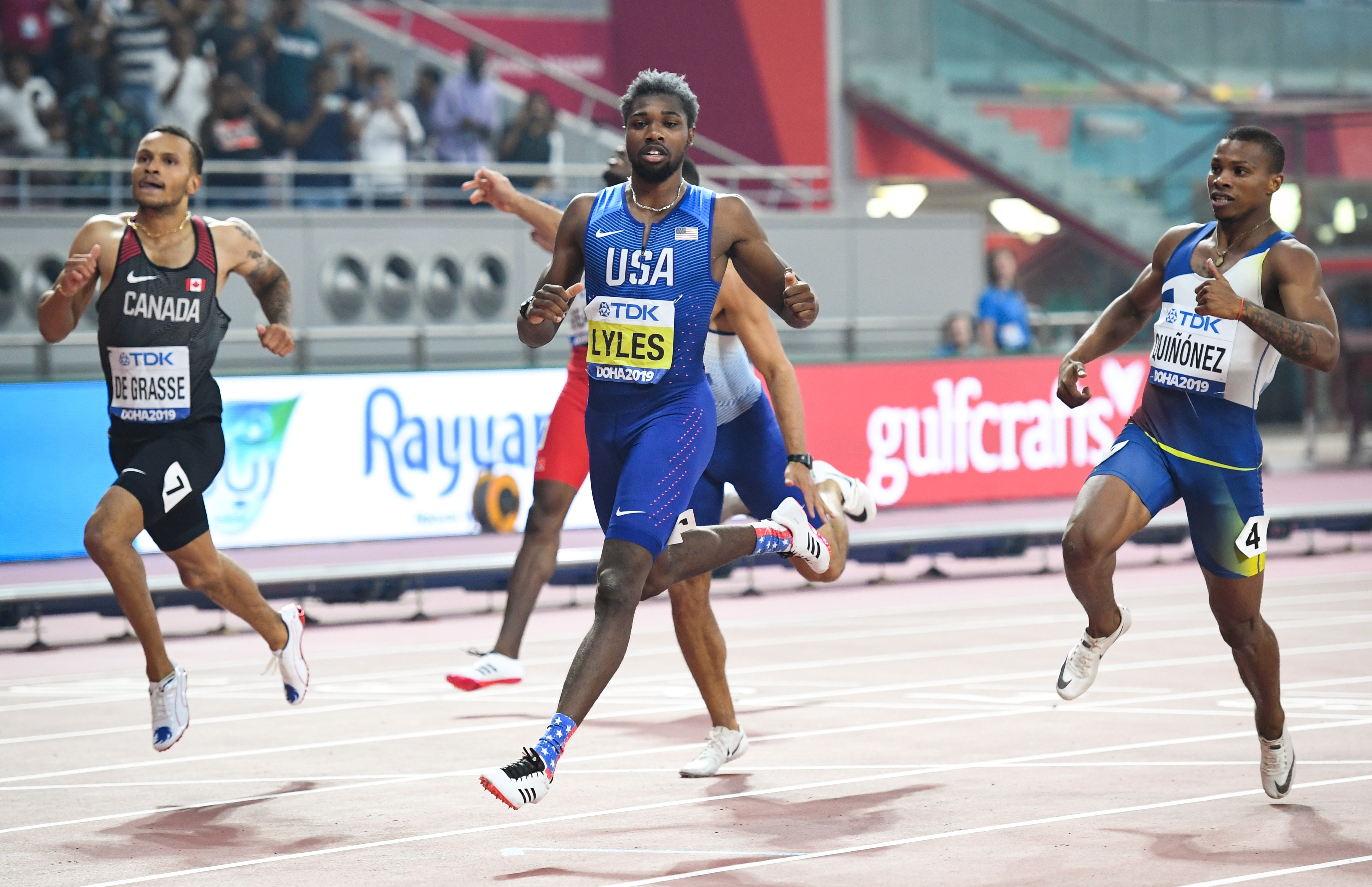 USA's Noah Lyles (C) wins ahead of Canada's Andre De Grasse (L) and Ecuador's Alex Quinonez (R) the Men's 200m final at the 2019 IAAF Athletics World Championships at the Khalifa International stadium in Doha on October 1, 2019. (Photo by Kirill KUDRYAVTSEV / AFP)        (Photo credit should read KIRILL KUDRYAVTSEV/AFP via Getty Images)
