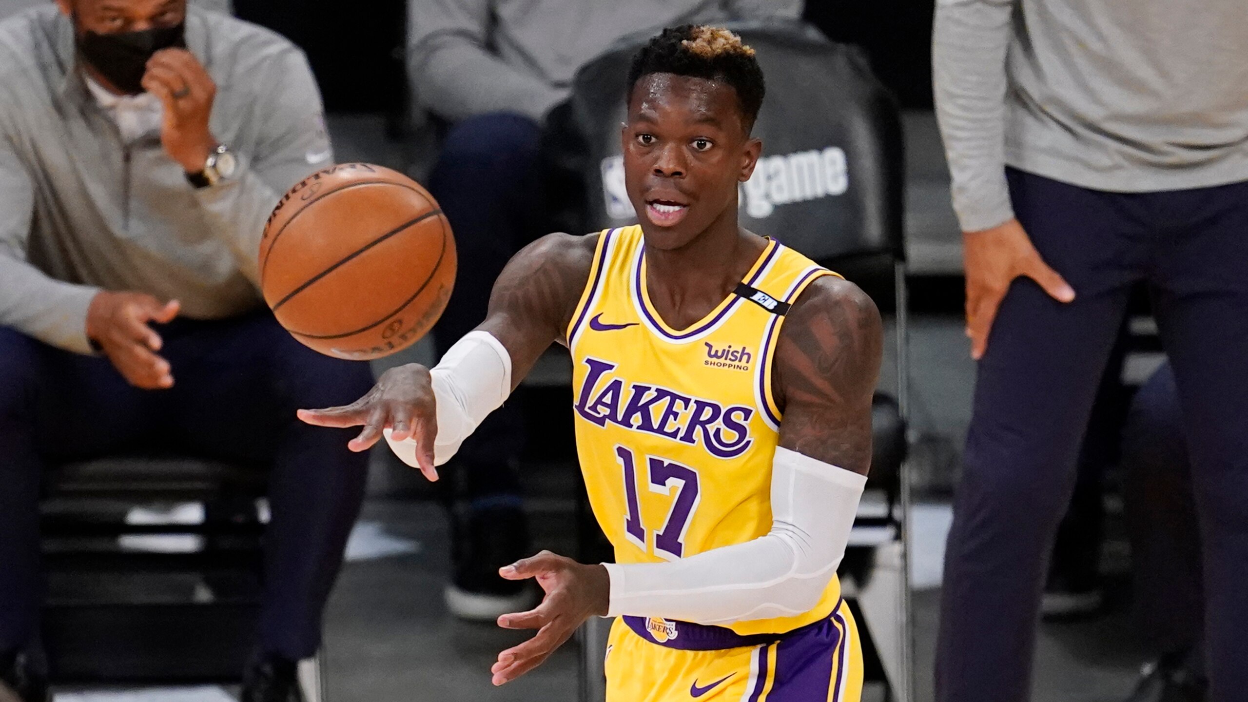 Los Angeles Lakers guard Dennis Schroder (17) passes during Game 3 of an NBA basketball first-round playoff series against the Phoenix Suns Thursday, May 27, 2021, in Los Angeles. (AP Photo/Marcio Jose Sanchez)
