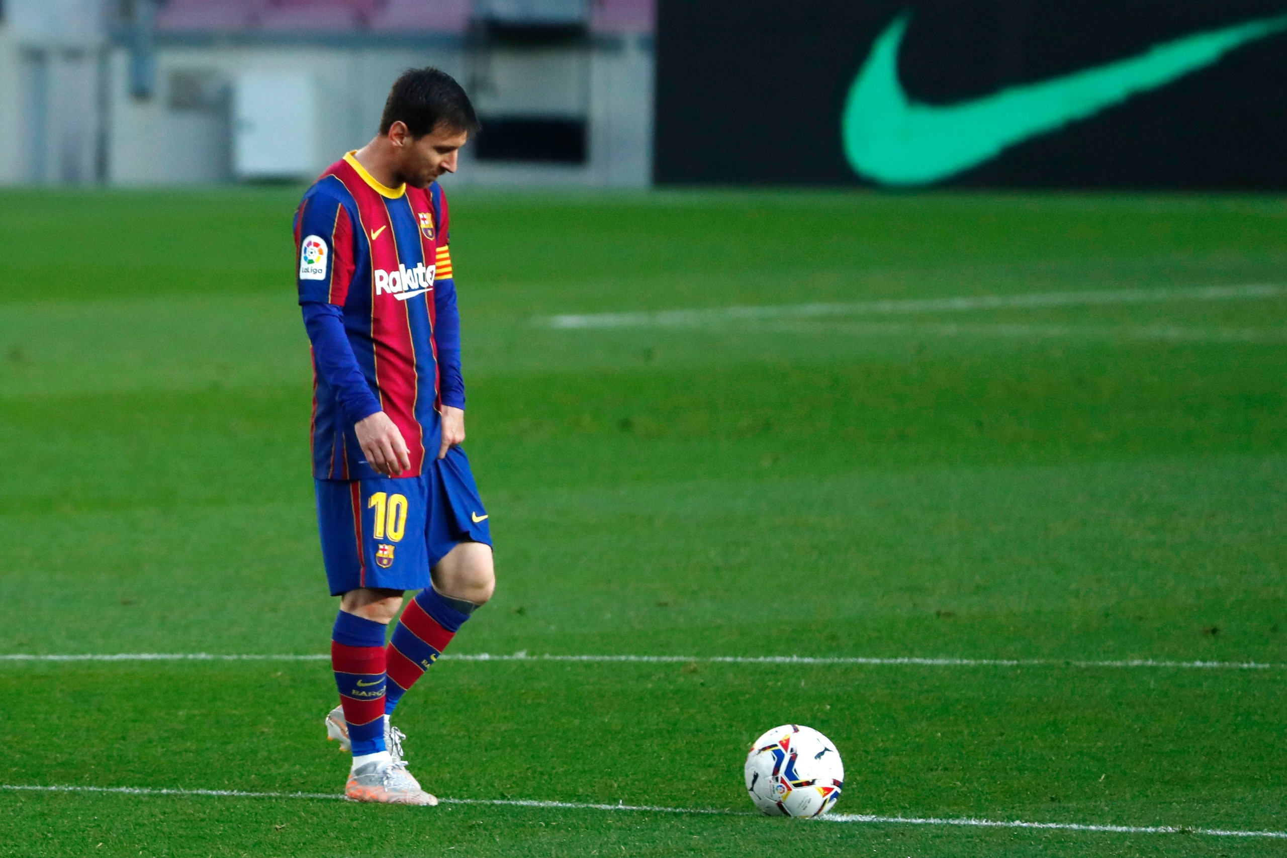 FILE - In this file photo dated Thursday, April 29, 2021, Barcelona's Lionel Messi reacts during the Spanish La Liga match against Granada at the Camp Nou stadium in Barcelona, Spain. Lionel Messi and Barcelona are closer to signing a new deal that would keep the Argentina soccer star at the Spanish club through the end of his playing career, according to an unidentified insider Friday July 16, 2021. (AP Photo/Joan Monfort, FILE)