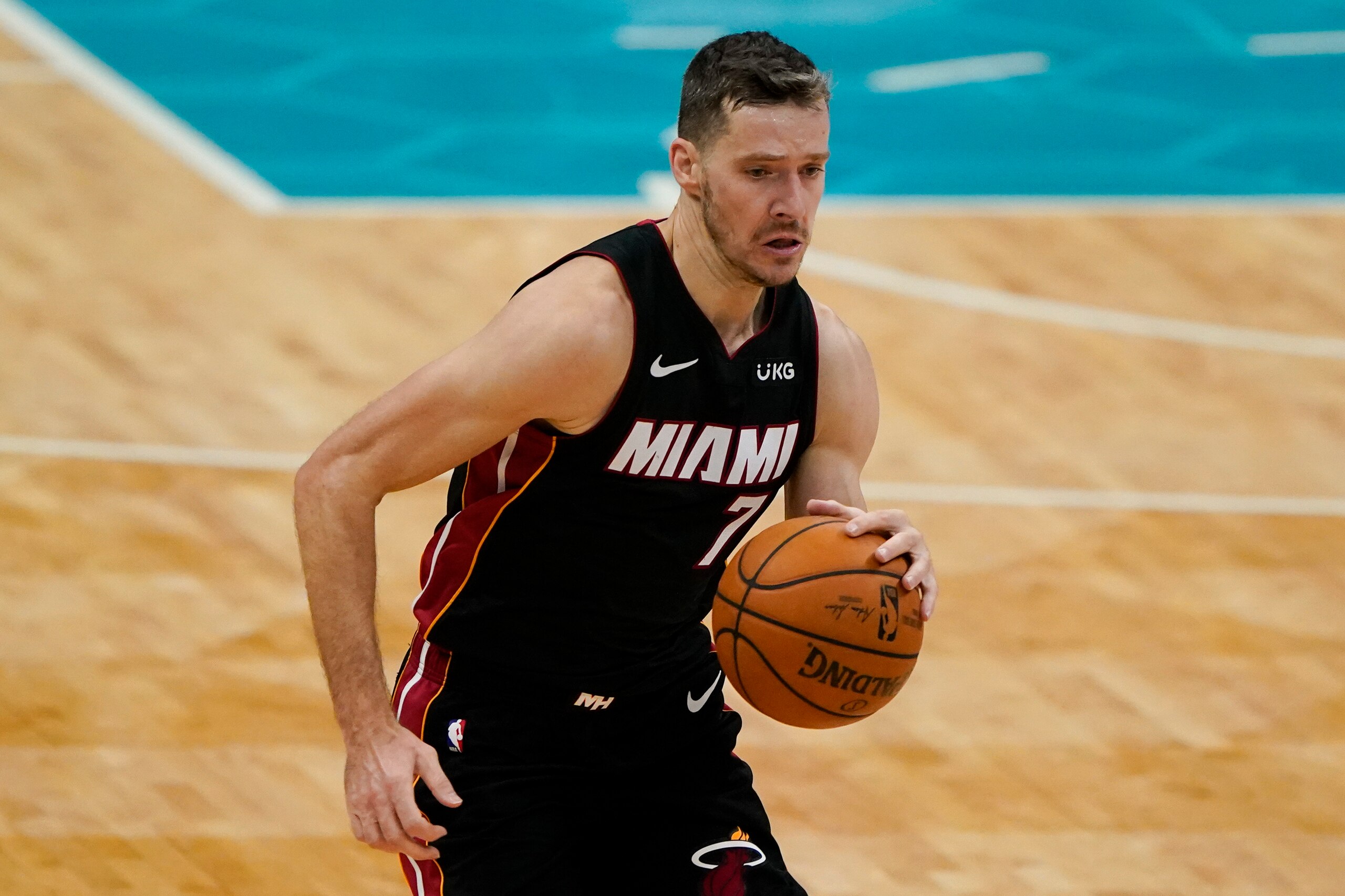Miami Heat guard Goran Dragic brings the ball down court against the Charlotte Hornets during the first half of an NBA basketball game on Sunday, May 2, 2021, in Charlotte, N.C. (AP Photo/Chris Carlson)