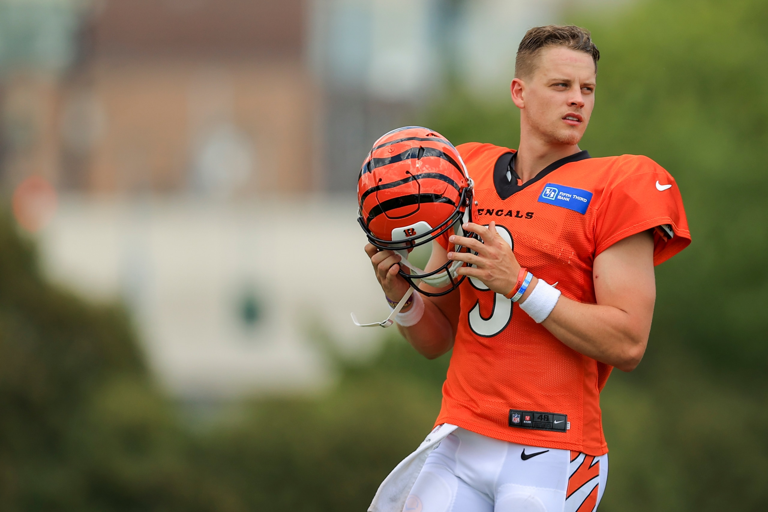 Cincinnati Bengals' Joe Burrow looks to participate in a drill during an NFL football practice in Cincinnati, Tuesday, Aug. 3, 2021. (AP Photo/Aaron Doster)