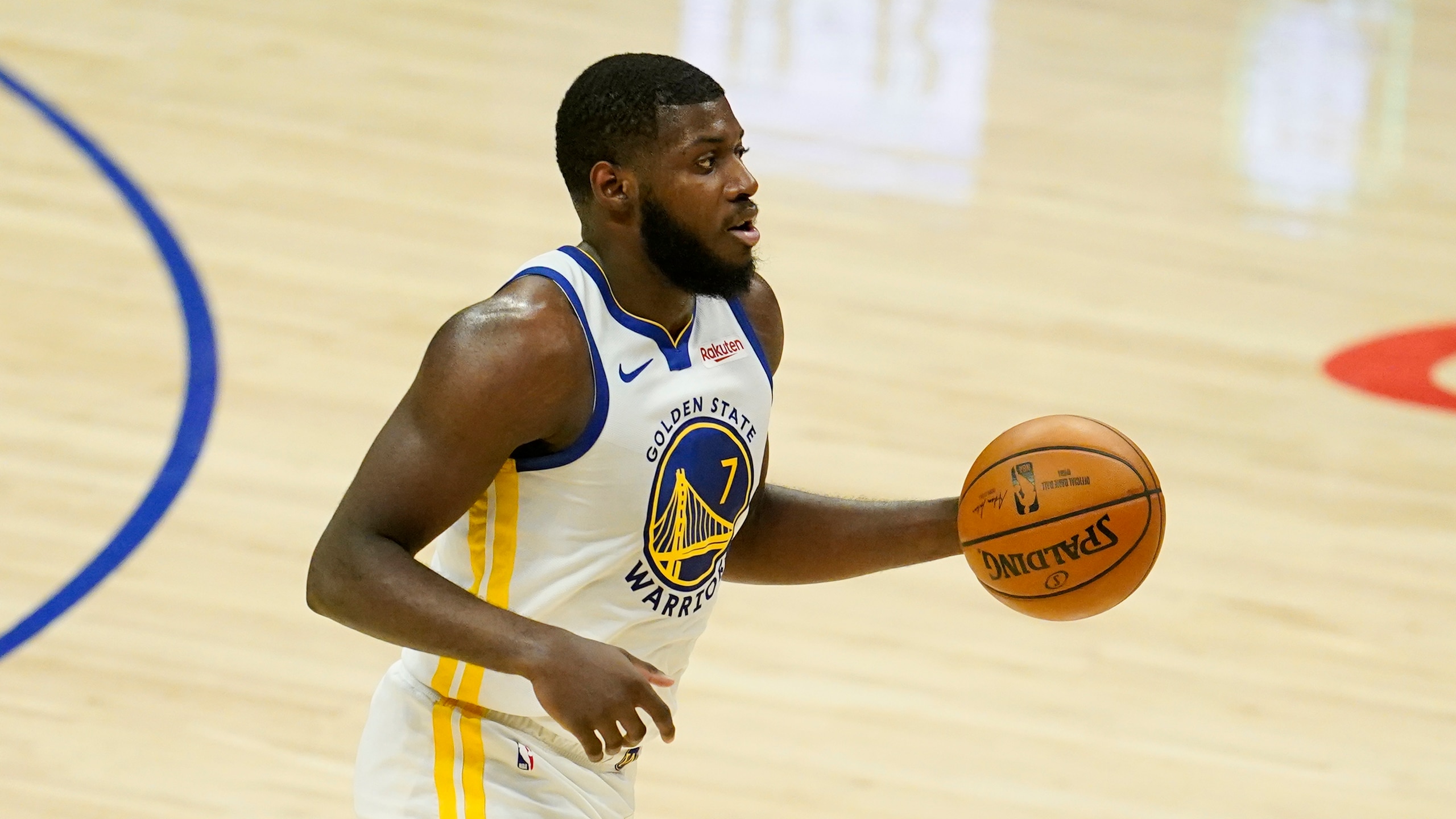 Golden State Warriors forward Eric Paschall (7) dribbles during an NBA basketball game against the Los Angeles Clippers Thursday, March 11, 2021, in Los Angeles. (AP Photo/Marcio Jose Sanchez)