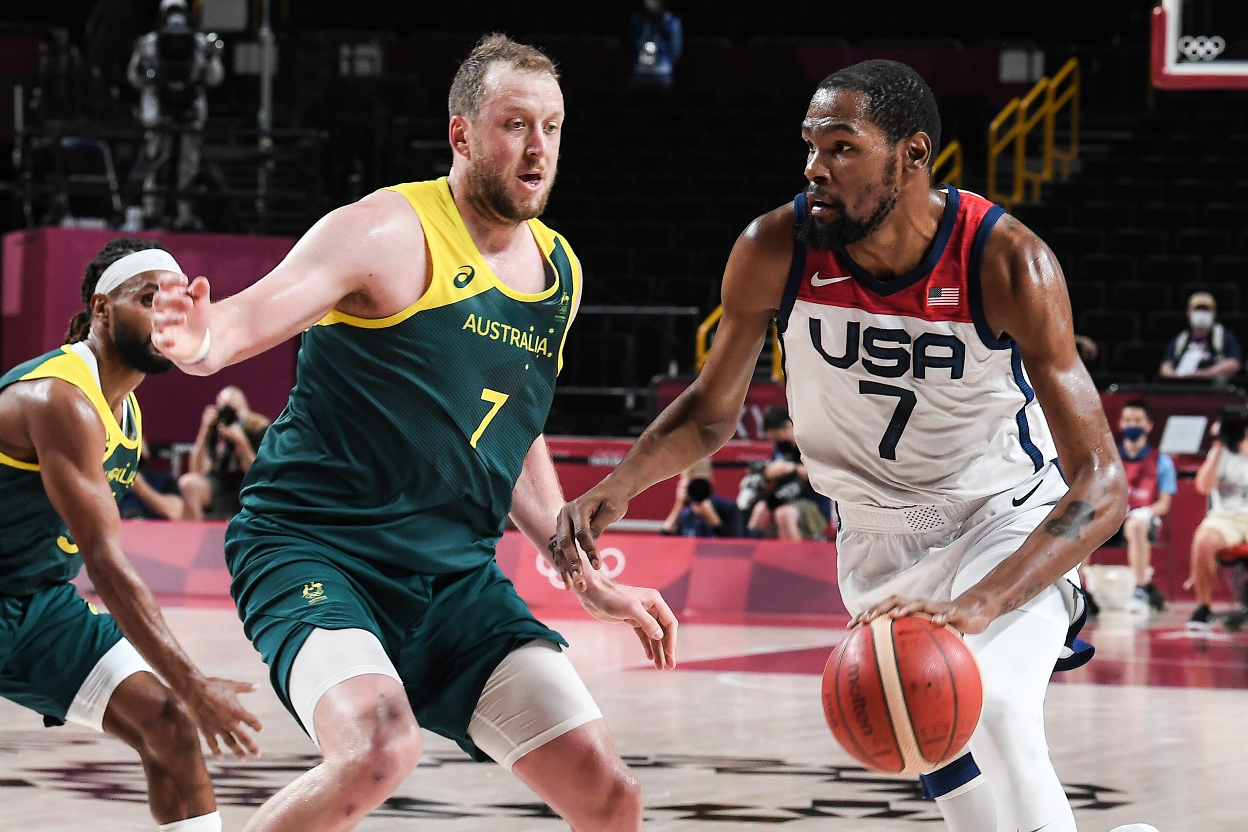 SAITAMA, JAPAN - AUGUST 05: Kevin Durant #7 of Team United States controls the ball against Joe Ingles #7 of Team Australia during the Men's Basketball Semifinal match between USA and Australia on day thirteen of the Tokyo 2020 Olympic Games at Saitama Super Arena on August 5, 2021 in Saitama, Japan. (Photo by Liu Yaru/CHINASPORTS/VCG via Getty Images)