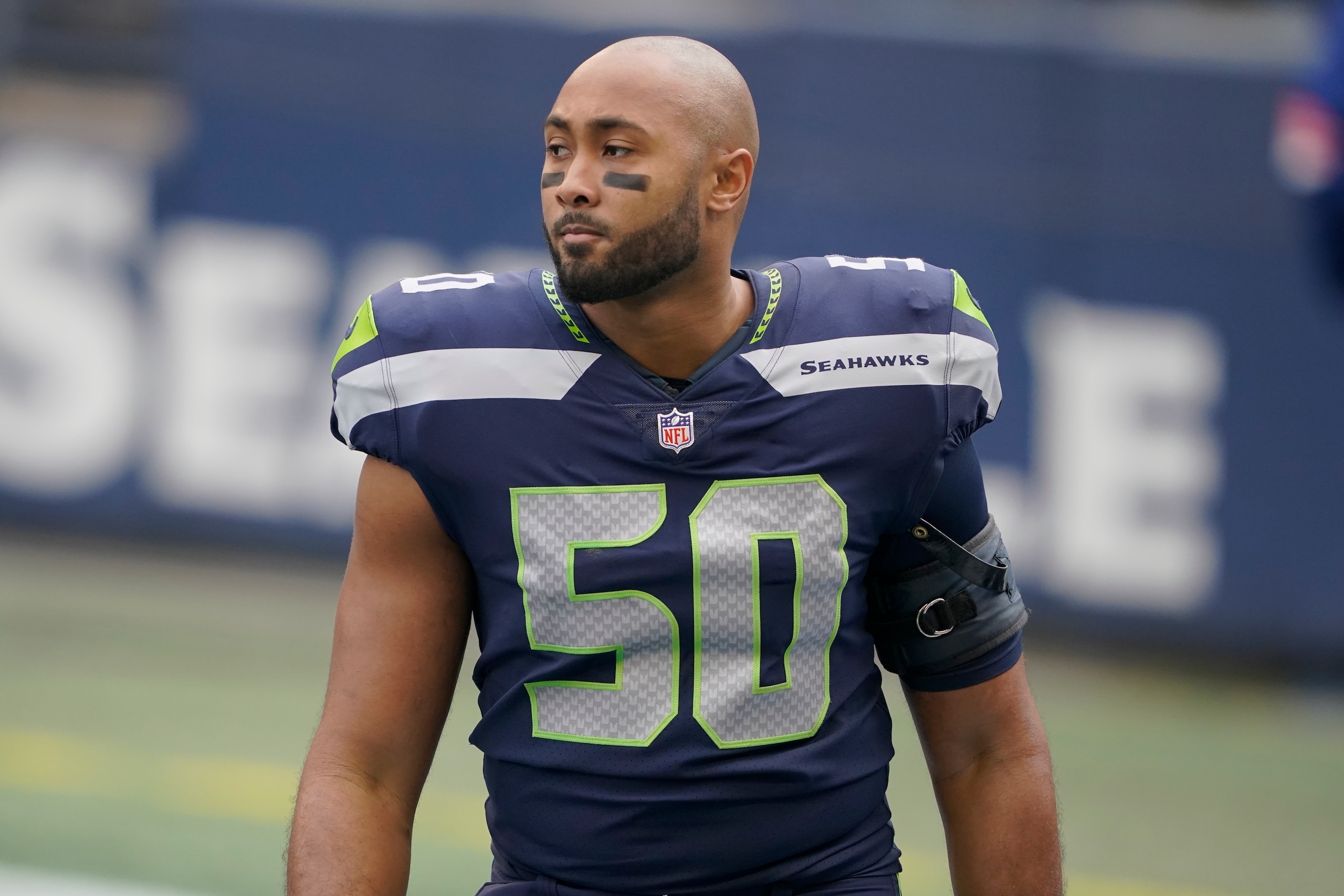 Seattle Seahawks outside linebacker K.J. Wright stands on the field before an NFL wild-card playoff football game against the Seattle Seahawks, Saturday, Jan. 9, 2021, in Seattle. (AP Photo/Ted S. Warren)