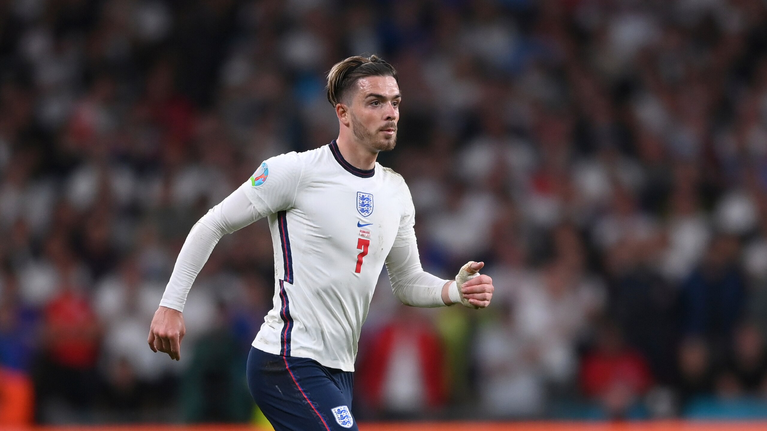 England's Jack Grealish runs during the Euro 2020 soccer semifinal match between England and Denmark at Wembley stadium in London, Wednesday, July 7, 2021. (Laurence Griffiths/Pool Photo via AP)