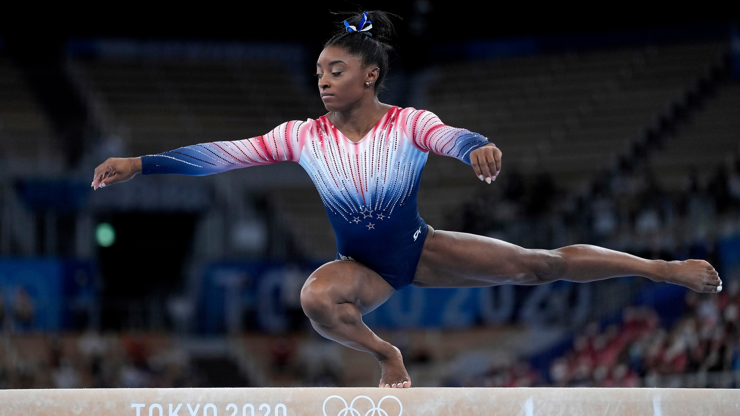 Simone Biles, of the United States, performs on the balance beam during the artistic gymnastics women's apparatus final at the 2020 Summer Olympics, Tuesday, Aug. 3, 2021, in Tokyo, Japan. (AP Photo/Ashley Landis)