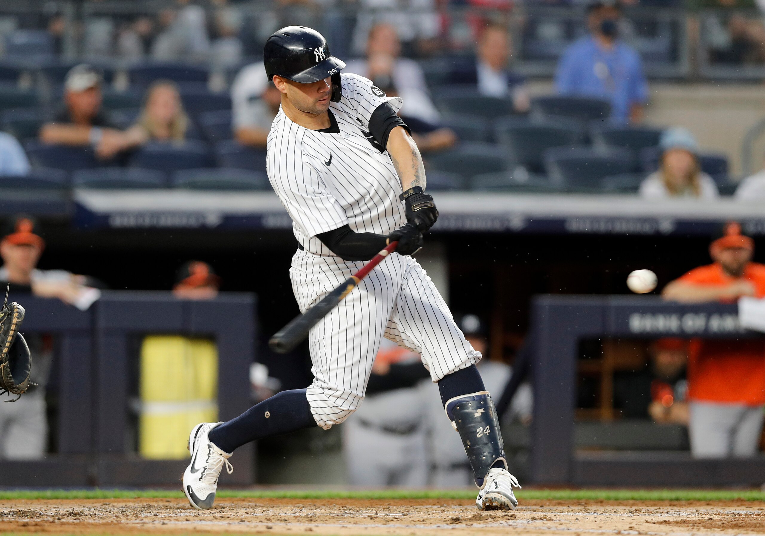 NEW YORK, NEW YORK - AUGUST 03:  Gary Sanchez #24 of the New York Yankees connects on a third inning RBI double against the Baltimore Orioles at Yankee Stadium on August 03, 2021 in New York City. The Yankees defeated the Orioles 13-1. (Photo by Jim McIsaac/Getty Images)